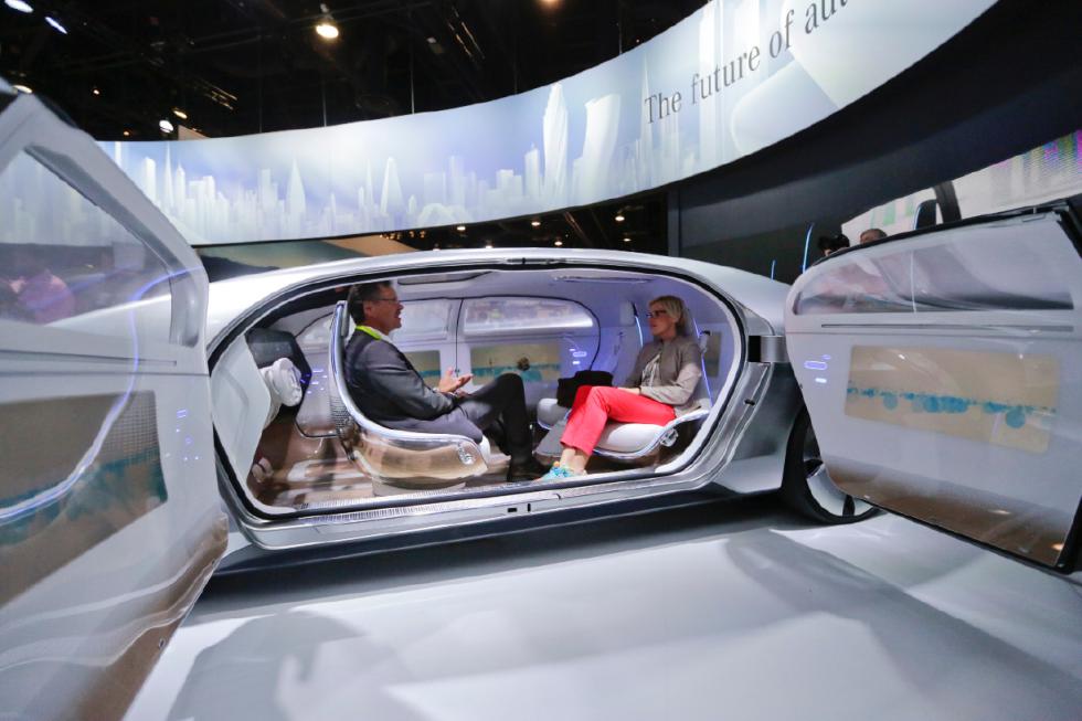 FILE - In this January 2015 file photo, attendees sit in the self-driving Mercedes-Benz F 015 concept car at the Mercedes-Benz booth at the International CES, in Las Vegas. Everything we buy or use these days has the potential to be smarter. Self-driving cars can transform our commuting hours into productive time. Sensor-laden socks can let us know how to jog with fewer injuries. The 2016 International CES will have a panoply of vendors showing off such connected devices, from smart umbrellas that will notify you if youve left them behind, to navigation devices that project directions on car windshields so you dont have to take your eyes off the road. (AP Photo/Jae C. Hong, File) - Jae C. Hong | AP