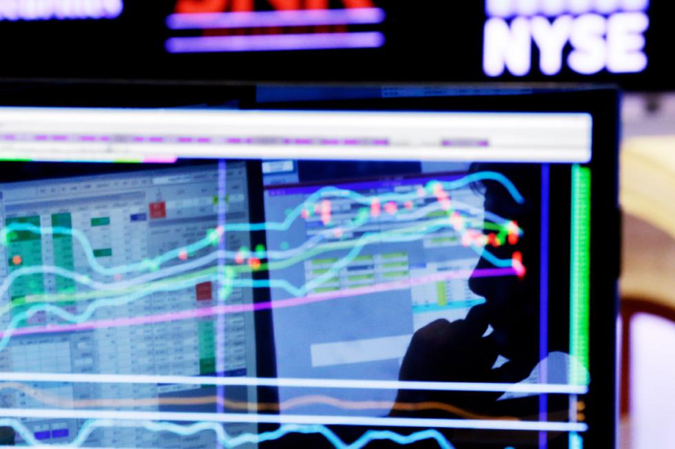 FILE - In this Monday, Jan. 11, 2016, file photo, specialist Anthony Rinaldi is silhouetted on a screen at his post on the floor of the New York Stock Exchange. A smoother ride for stock investors sounds like a no-brainer given this years big swings for the stock market, but the low-volatility funds pitched by the investment industry come with their own risks. (AP Photo/Richard Drew, File) - Richard Drew | AP