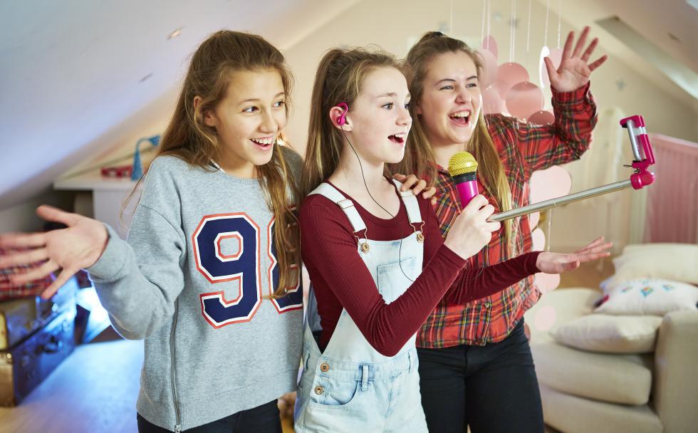This photo provided by Moose Toys shows the Selfiemic.  This toy lets kids create and share their own pop music videos. Its basically a selfie stick with a microphone on one end.  (Moose Toys via AP) - Moose Toys