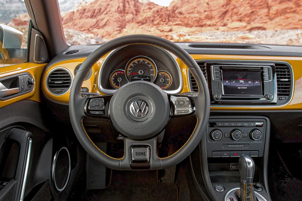 The 2016 Volkswagen Beetle Dune, beefed-up and off-road inspired, is athletic and agile -- especially for urban duties. Interior amenities include heated front sport seats, a unique instrument cluster, and a leather-wrapped steering wheel. (Volkswagen/TNS) - Volkswagen | TNS