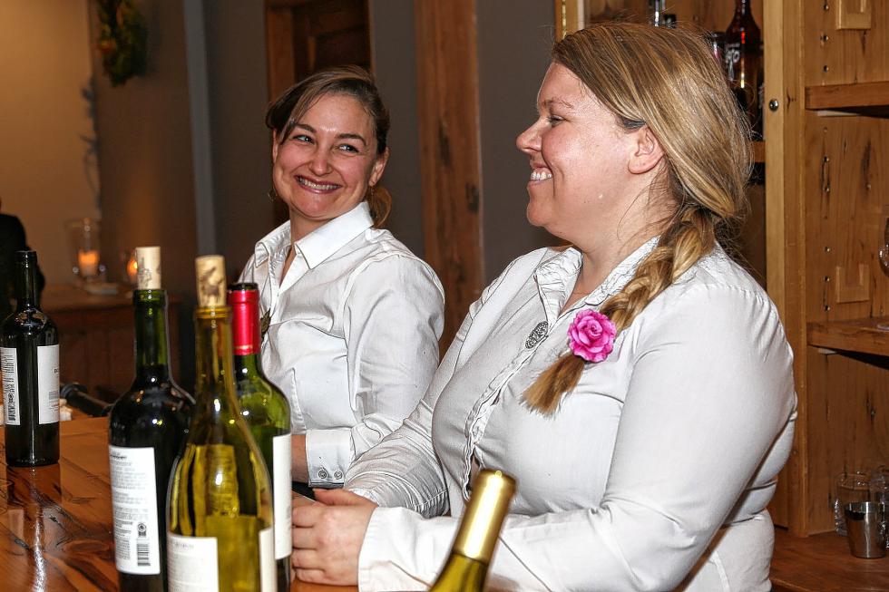 Rose Pfeiffer and Beth Pollari staffed the bar at the Chamber-to-Chamber mixer on Feb. 10 at Simon Pearce in Quechee, hosted by the Woodstock Area Chamber of Commerce and the Hartford Area Chamber of Commerce. (Gloria Towne photograph/allaroundtowne.com) - Gloria Towne |
