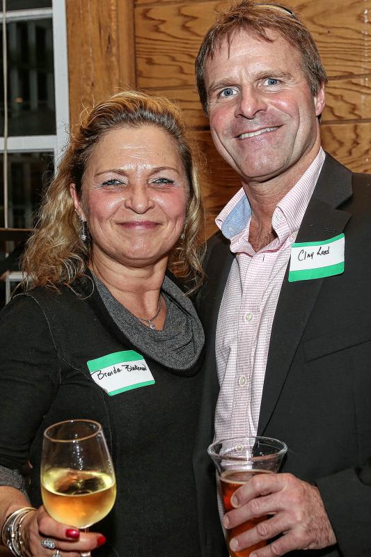 Brenda Blakeman, treasurer of the  Woodstock Chamber of Commerce, and Chamber member Clay Reed, at the Chamber-to-Chamber mixer on Feb. 10 at Simon Pearce in Quechee, hosted by the Woodstock Area Chamber of Commerce and the Hartford Area Chamber of Commerce. (Gloria Towne photograph/allaroundtowne.com) - Gloria Towne |