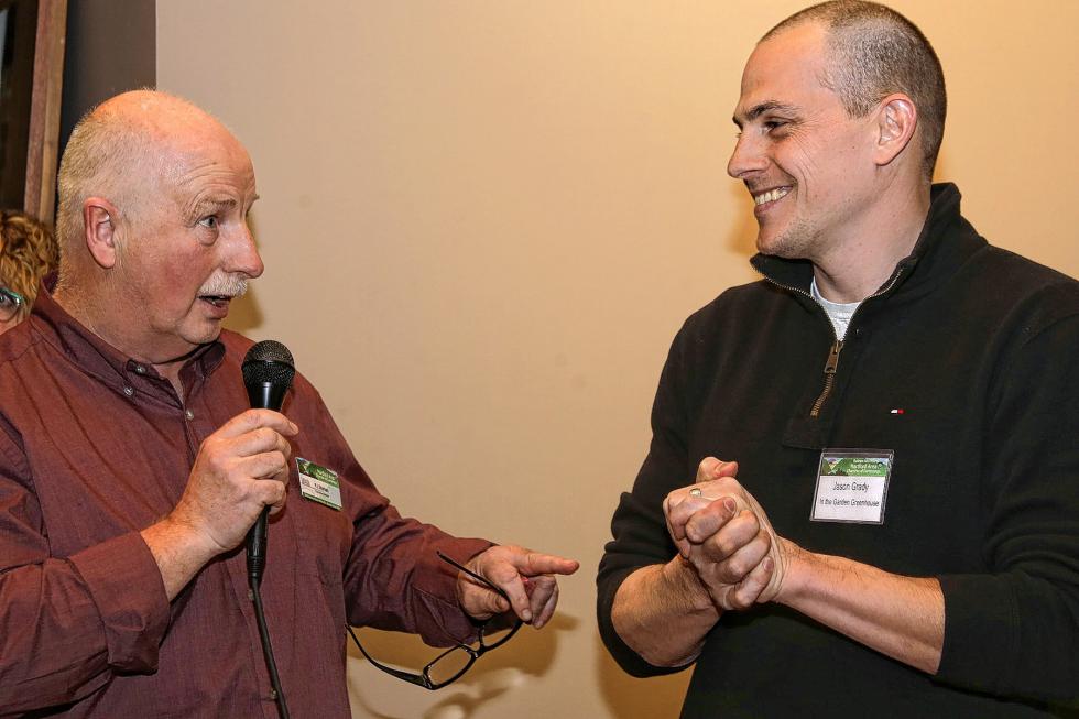 PJ Skehan, executive director of the Hartford Area Chamber of Commerce, speaks with Jason Grady of In the Garden Greenhouse, during the Chamber-to-Chamber mixer on Feb. 10 at Simon Pearce in Quechee, hosted by the Woodstock Area Chamber of Commerce and the Hartford Area Chamber of Commerce. (Gloria Towne photograph/allaroundtowne.com) - Gloria Towne |