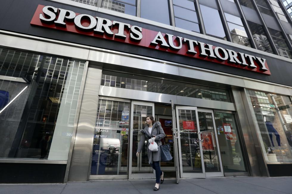 A woman leaves a Sports Authority store, in New York, Wednesday, March 2, 2016. Sports Authority is filing for Chapter 11 bankruptcy protection. The Englewood, Colo., company has 463 stores in 41 states and Puerto Rico. (AP Photo/Richard Drew) - Richard Drew | AP