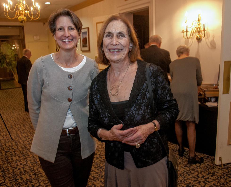 Architect Sloane Mayor and Bente Torjusen, executive director of AVA Gallery and Art Center, at the Lebanon Chamber of Commerce's 100th anniversary celebration on Friday, March 4, 2016, at the Fireside Inn & Suites in West Lebanon. (Medora Hebert photograph) -