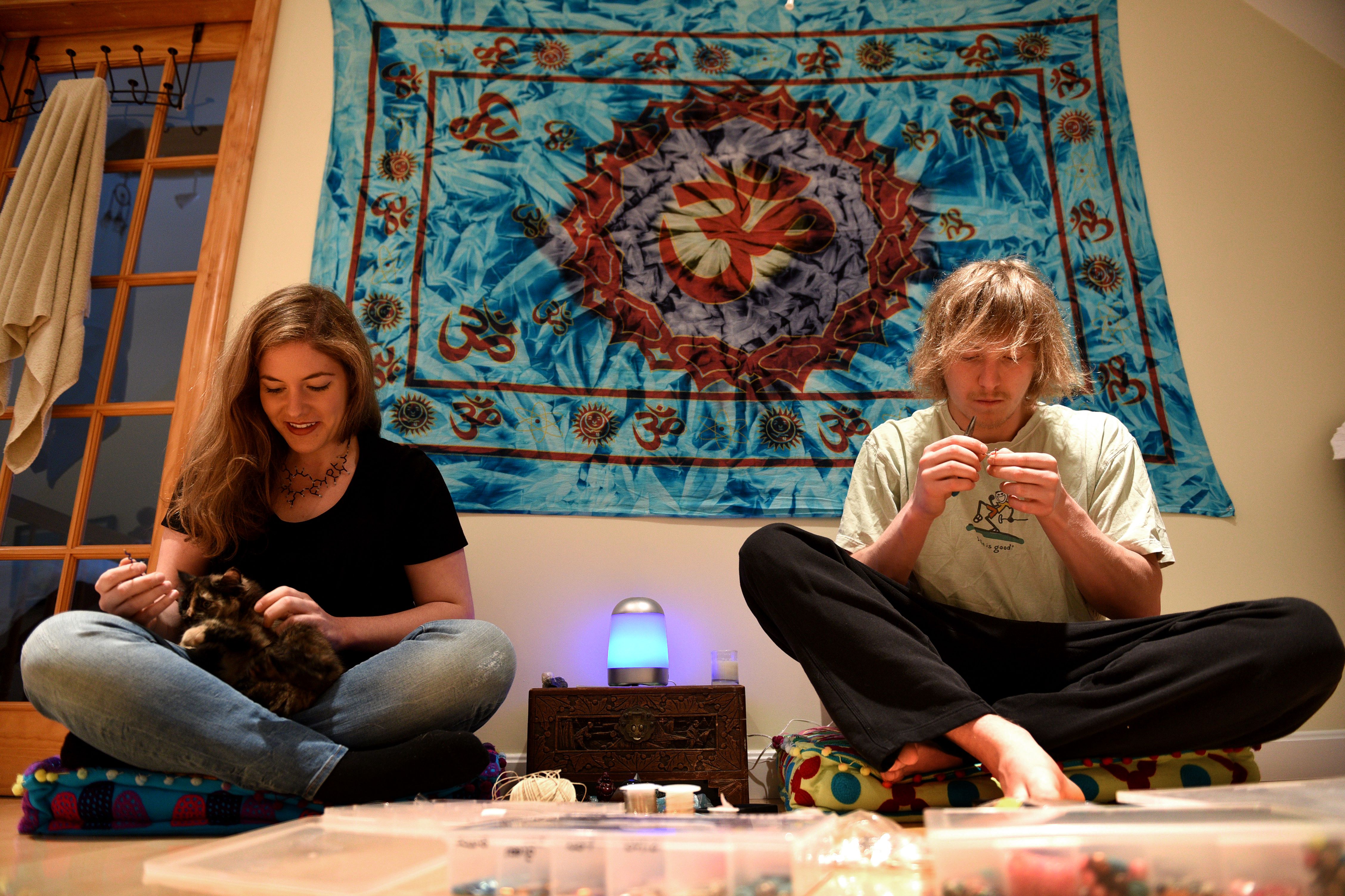 Rachel Henne and Andrew Switz make jewelry in the shape of various molecules at their home in Quechee, Vt., on May 18, 2016. Their kitten Tina is in Henne’s lap. (Valley News - Jennifer Hauck) Copyright Valley News. May not be reprinted or used online without permission. Send requests to permission@vnews.com.
