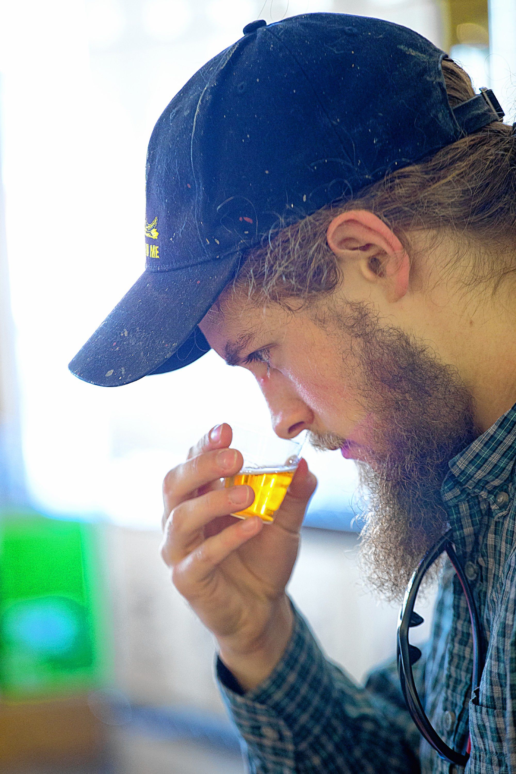 Nick Conquest, of Lebanon, N.H., smells a sample of Lagunitas IPA Maximus Ale before tasting it at the Lebanon Brew Shop in Lebanon, N.H., on September 16, 2016. Conquest has helped his friend with homebrewing and comes by regularly for the store’s weekly tastings. (Valley News - Geoff Hansen) Copyright Valley News. May not be reprinted or used online without permission. Send requests to permission@vnews.com.