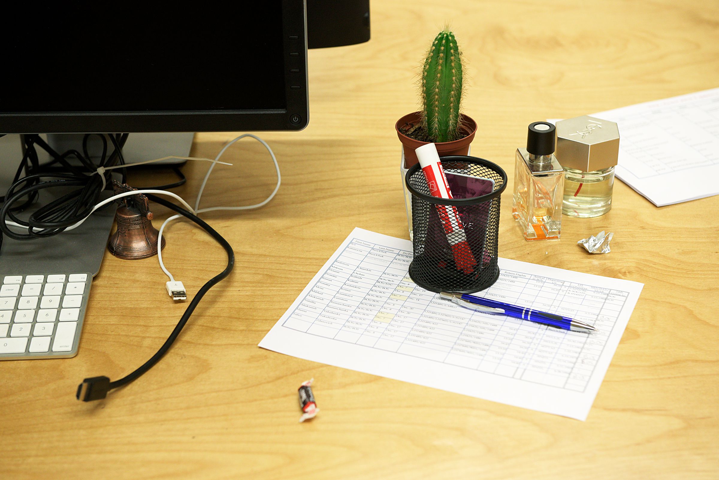 A cactus, a tootsie roll, perfume, a miniature of the Liberty Bell, sit at a work space in the Appcast office in the Whitman Communications Building in Lebanon, N.H., Thursday October 27, 2016. (Valley News - James M. Patterson) Copyright Valley News. May not be reprinted or used online without permission. Send requests to permission@vnews.com.
