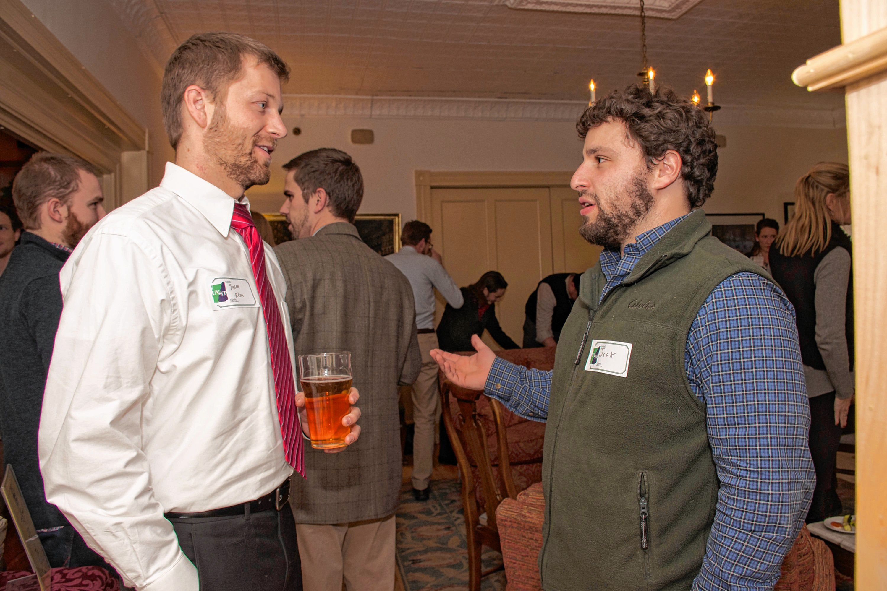 Jason Kendall, of Etna, an accountant at Gallagher, Flynn & Co, chats with Jack Kaunders, a lawyer living in Thetford, at the Upper Valley Young Professionals holiday party and canned food drive at the Norwich Inn on Dec. 15. (Nancy Nutile-McMenemy photograph, photosbynanci@comcast.net)
