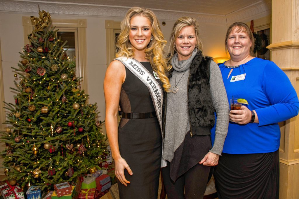 Miss Vermont USA Madison Cota, of Bellows Falls, Vt., poses for a picture at the Upper Valley Young Professionals holiday party and canned food drive at the Norwich Inn on Dec. 15 with her mother, Jennifer, center, who works at King Arthur Flour, and Angela Nelson, right, who lives in Croydon and is an accountant at AM Peisch in Lebanon. Cota is a social media manager at LaSalle College. (Nancy Nutile-McMenemy photograph, photosbynanci@comcast.net)