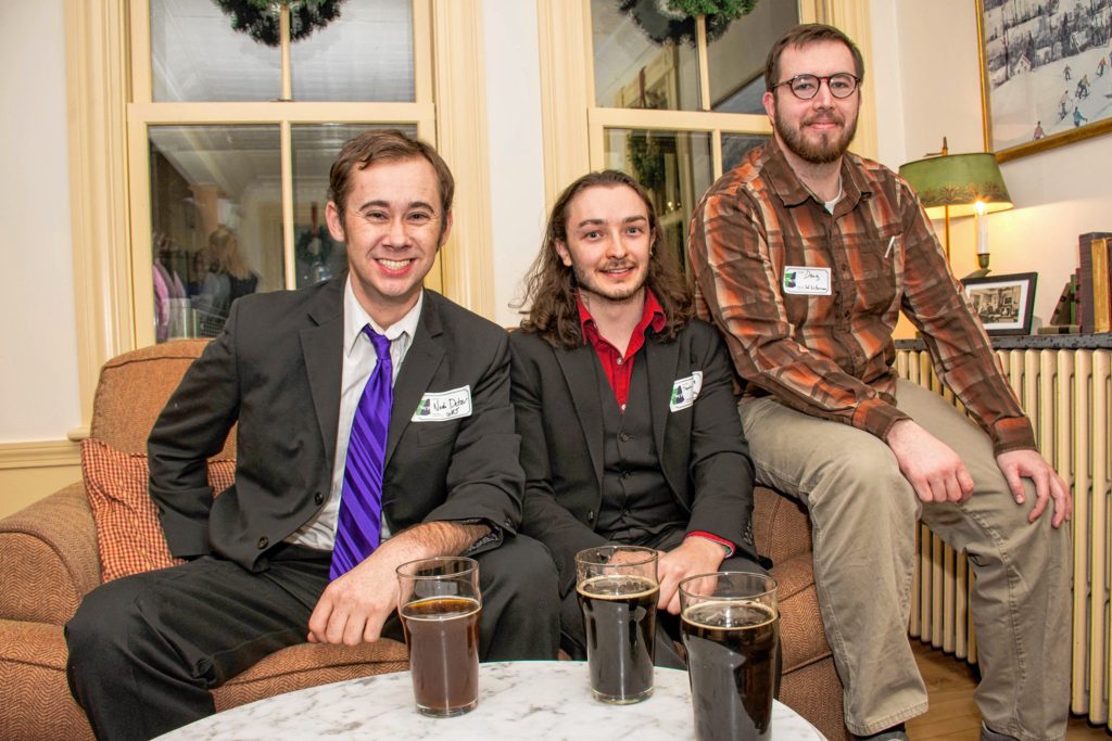 Noah Detzer, left, of White River Junction, an English teacher at Hartford High School; Devin Wilkie, of West Lebanon, a publisher at Steerforth Press in Hanover; and Doug McKenna, of West Lebanon, a middle school teacher in Claremont, mingle at the Upper Valley Young Professionals holiday party and canned food drive at the Norwich Inn on Dec. 15. (Nancy Nutile-McMenemy photograph, photosbynanci@comcast.net)