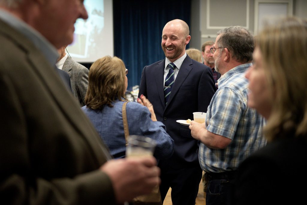 Dan O'Halloran, of North Sutton, N.H., outgoing president of the Lake Sunapee Region Chamber of Commerce, socializes before the organization's annual meeting at Colby-Sawyer College in New London, N.H., on Tuesday, January 18, 2017. During the meeting, O'Halloran handed over the office to Rich Marshall, of New London. (Valley News - James M. Patterson) Copyright Valley News. May not be reprinted or used online without permission. Send requests to permission@vnews.com.