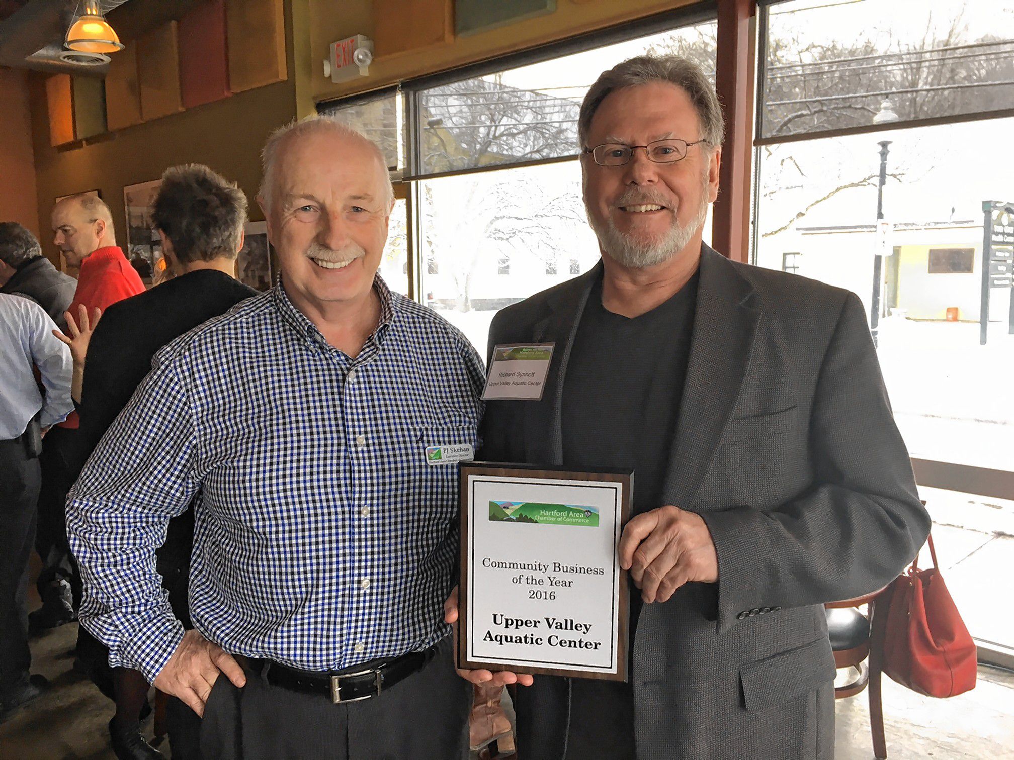 Rich Synnott, right, executive director of the Upper Valley Aquatic Center, accepted the Community Business of the Year award from P.J. Skehan of the Hartford Area Chamber of Commerce. (Courtesy photograph)