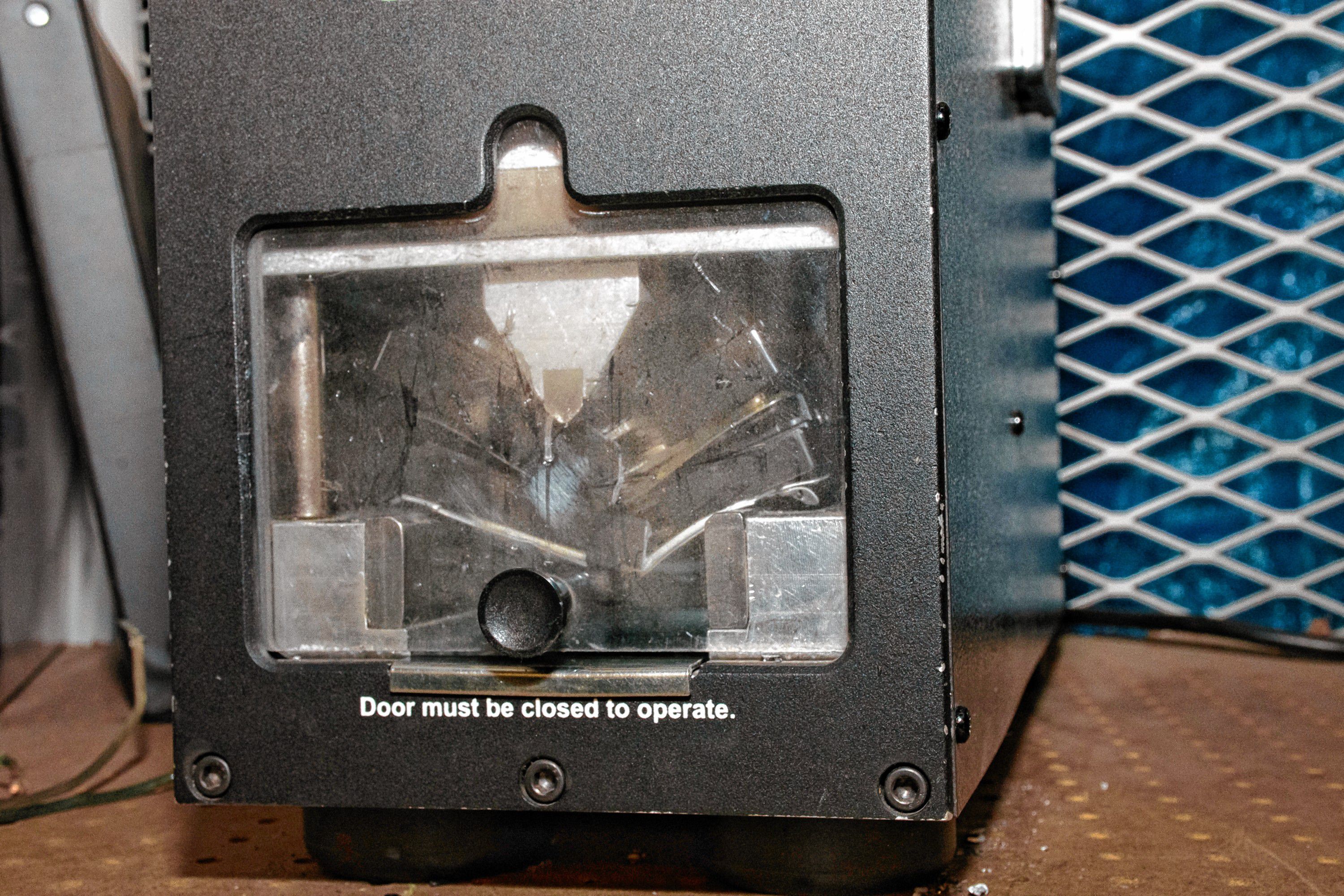 The data destroyer crushes a hard drive to comply with highest NSA standards to prevent data theft. Nancy Nutile-McMenemy photograph