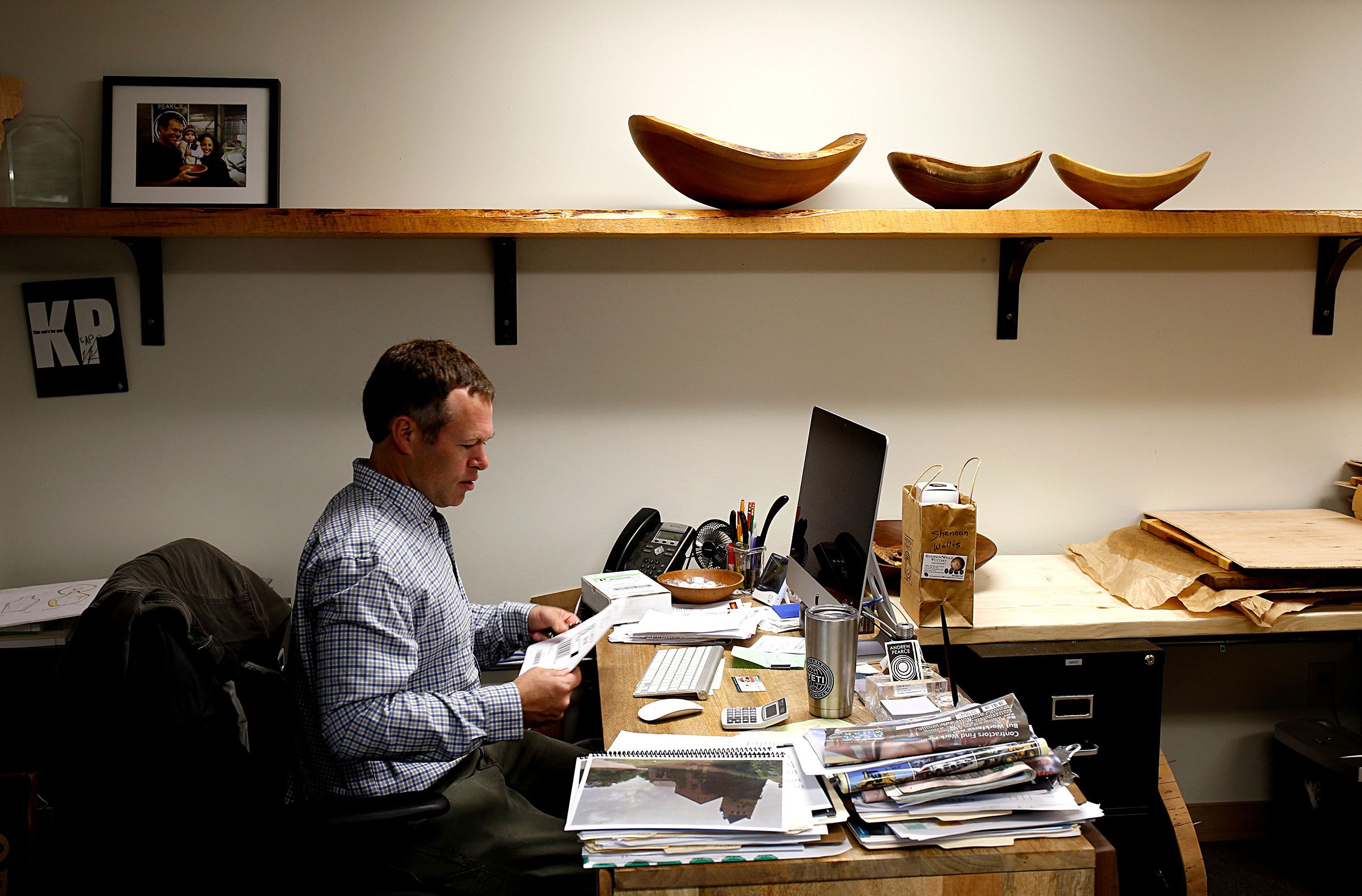 Andrew Pearce works in the office at his manufacturing facility and showroom in Hartland, Vt., on April 12, 2017. Pearce started the business in 2014 in Bethel, Vt. The company made 8,500 bowls last year. (Valley News - Geoff Hansen) Copyright Valley News. May not be reprinted or used online without permission. Send requests to permission@vnews.com.