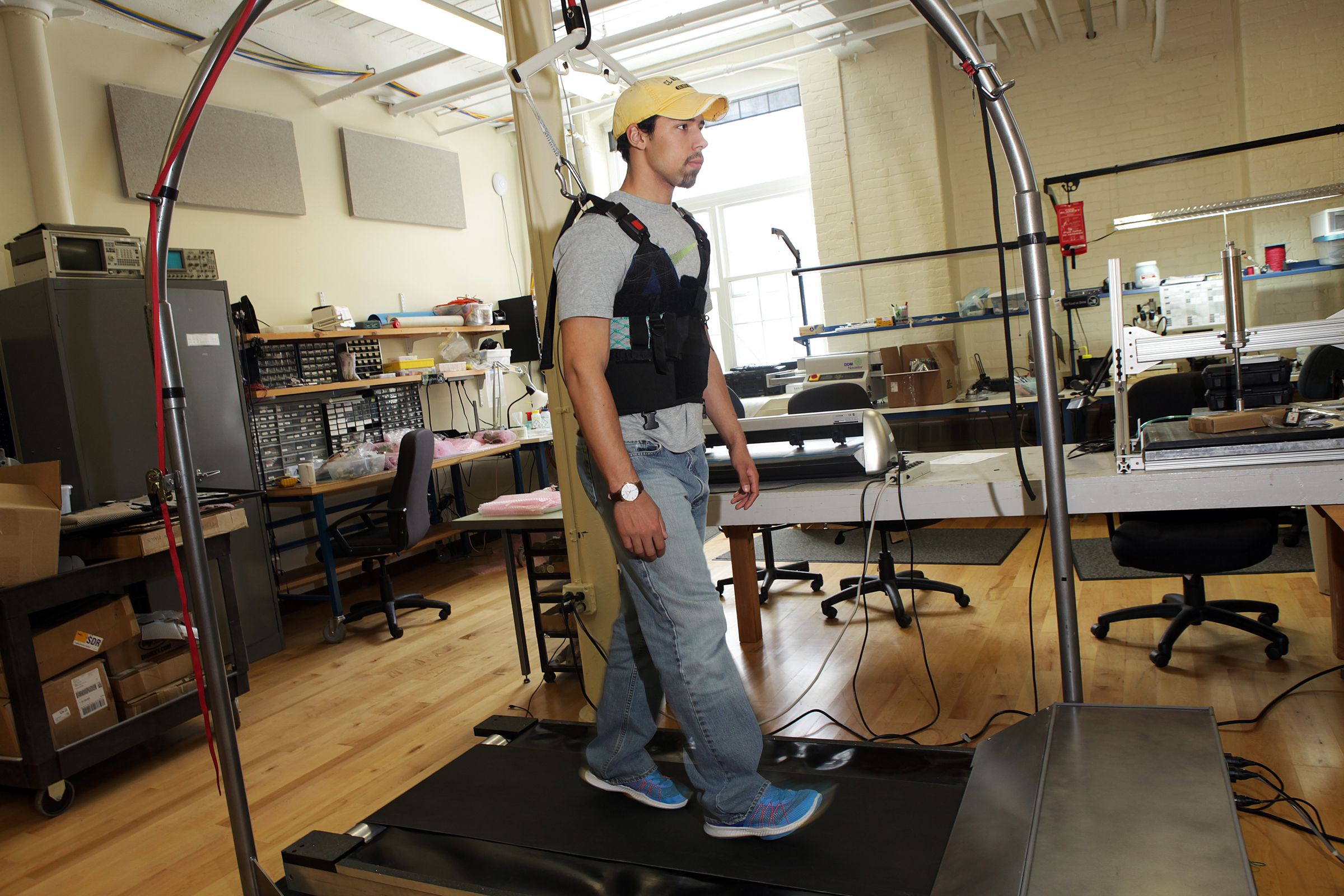 Alexander Hastings, an intern at Simbex, demonstrates Simbex ActiveStep technology on Thursday, April 13, 2017, in Lebanon, N.H. The physical rehabilitation treadmill, ActiveStep, is computer-controlled and outfitted with a harness to help patients who've suffered from slips relearn how to gain their balance. (Valley News - Jovelle Tamayo) Copyright Valley News. May not be reprinted or used online without permission. Send requests to permission@vnews.com.