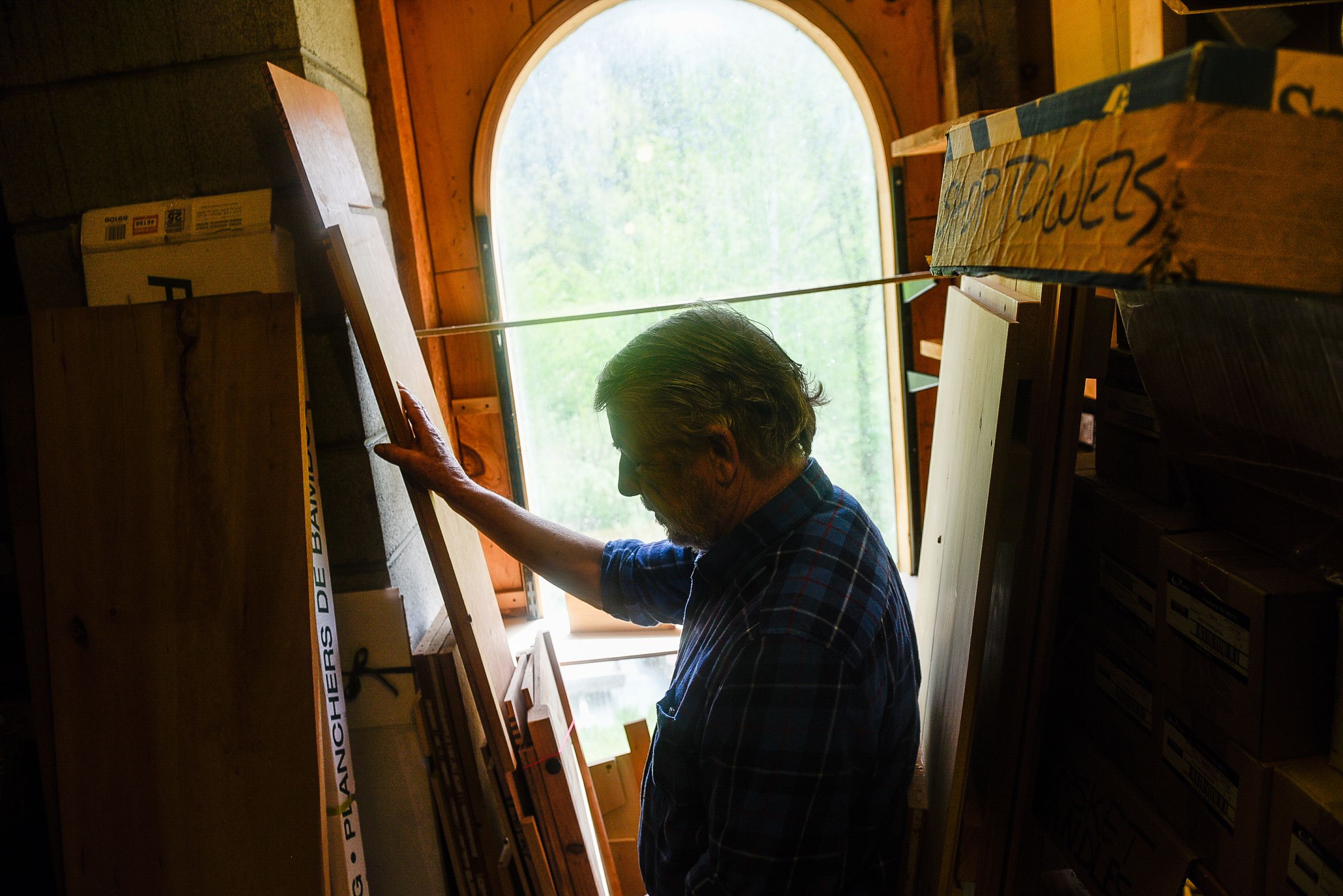 Michael Whitman, a volunteer educator with the nonprofit Funeral Consumers Alliance, at his Lyme, N.H. woodworking shop on Sunday, May 21, 2017. Whitman crafts a few simple wooden caskets annually. (Valley News - Jovelle Tamayo) Copyright Valley News. May not be reprinted or used online without permission. Send requests to permission@vnews.com.