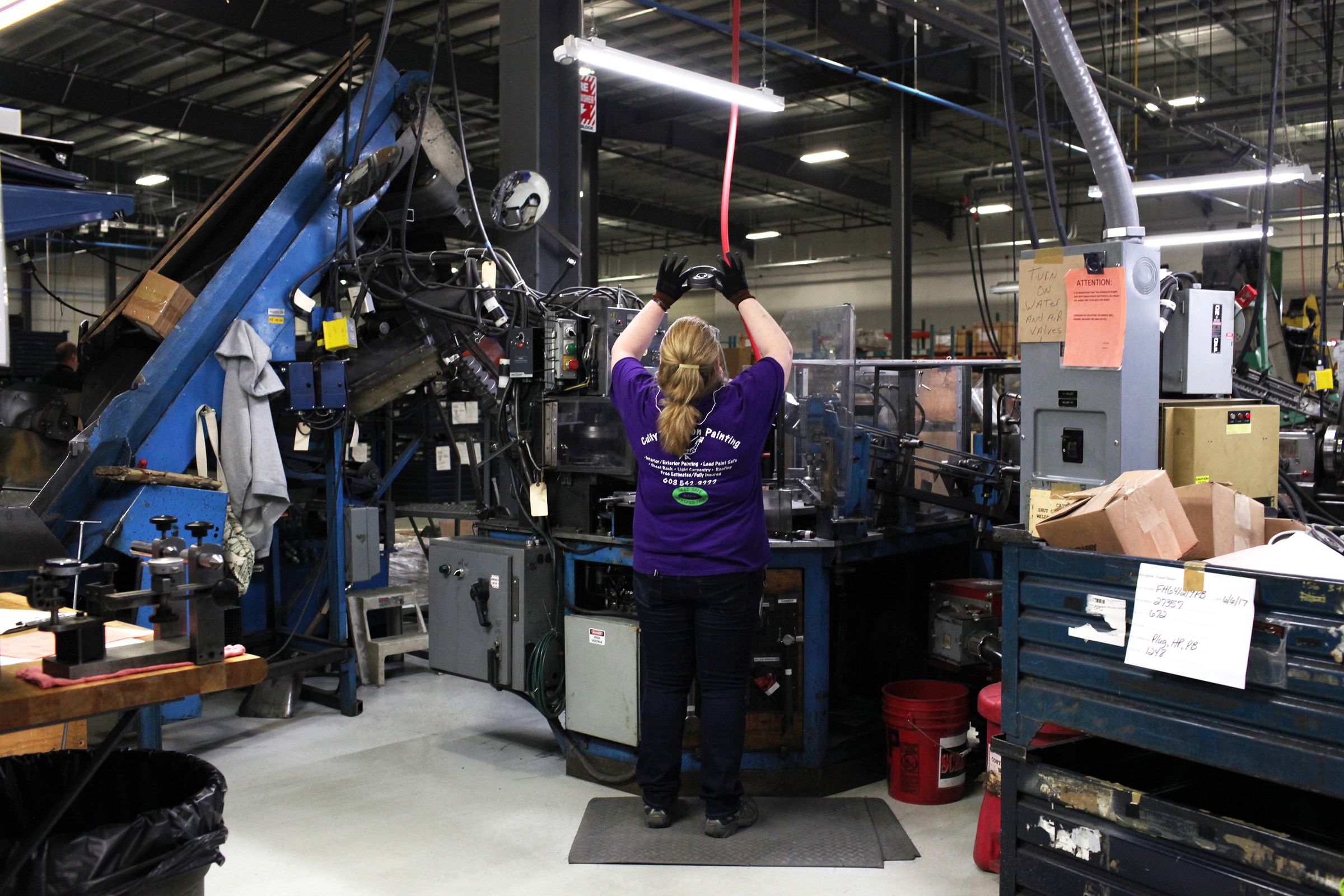 Kim Borcuk, of Claremont, N.H., inspects a pulley part at New Hampshire Industries, also known as NHI, on Tuesday, June 6, 2017, in Claremont. NHI, a pulley manufacturer, recently consolidated its operations from Lebanon, N.H. and Wisconsin to a 137,000-square-foot building in Claremont. (Valley News - Jovelle Tamayo) Copyright Valley News. May not be reprinted or used online without permission. Send requests to permission@vnews.com.