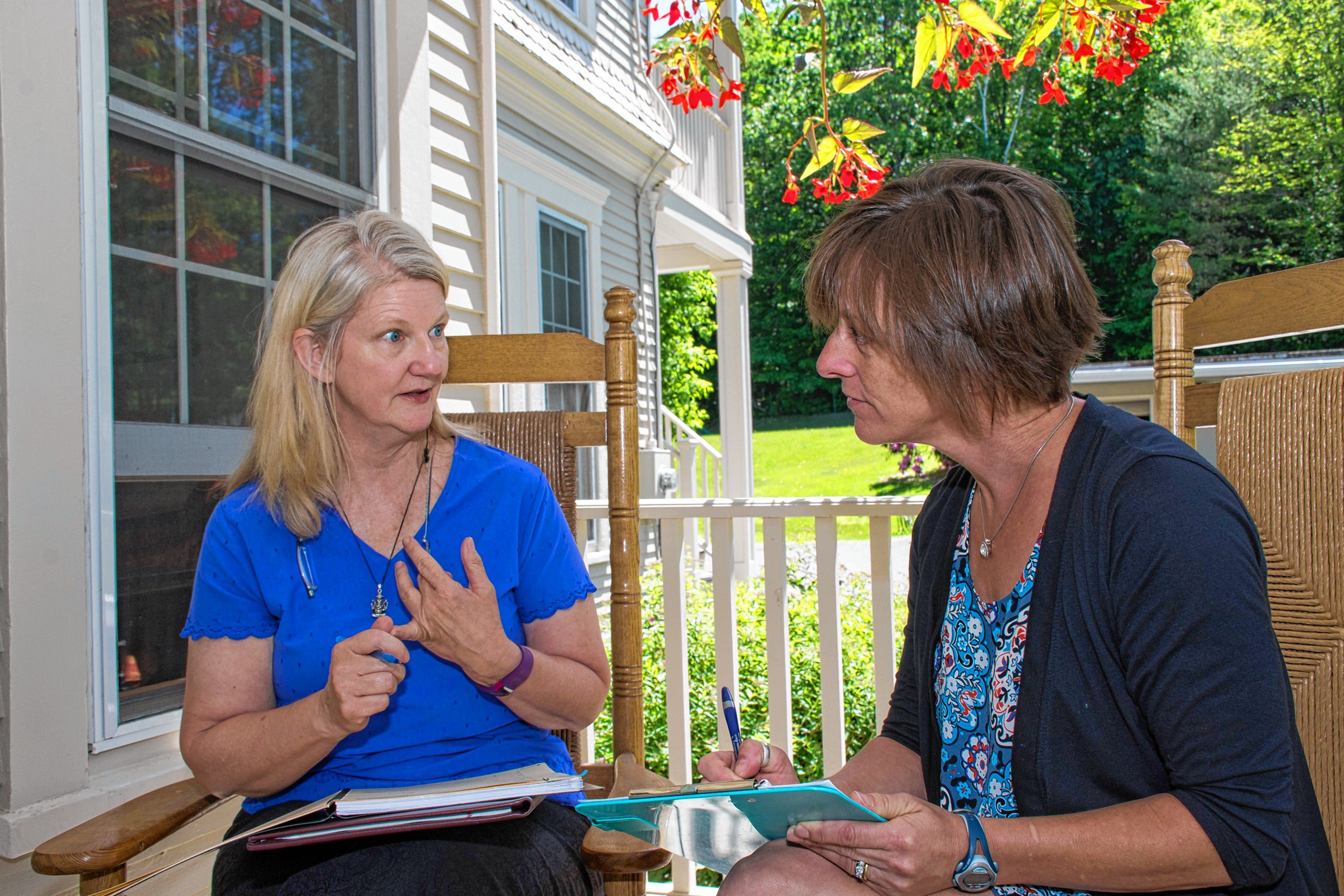 Eileen O'Connor, left, of West Lebanon, N.H., meets with Sarah Dole of Easy Peasy Organizing, right, to set goals and time frames for transitioning O'Connor's home and yard from winter to summer. Nancy Nutile-McMenemy photograph.