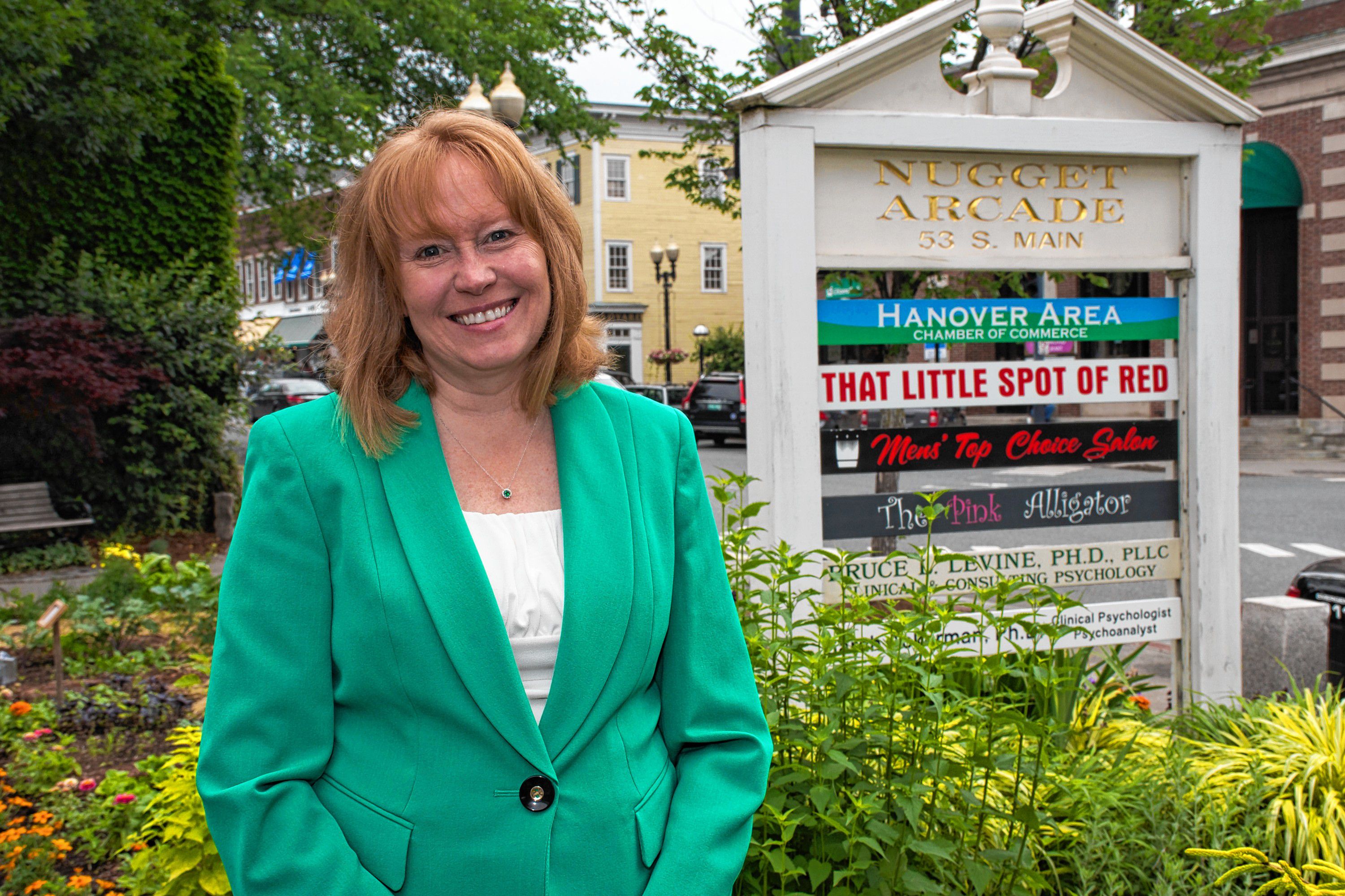 The Hanover Area Chamber of Commerce is located in the Nugget Arcade in downtown Hanover. The new executive director, Tracy Hutchins stand in front of the building's sign. Nancy Nutile-McMenemy photograph.