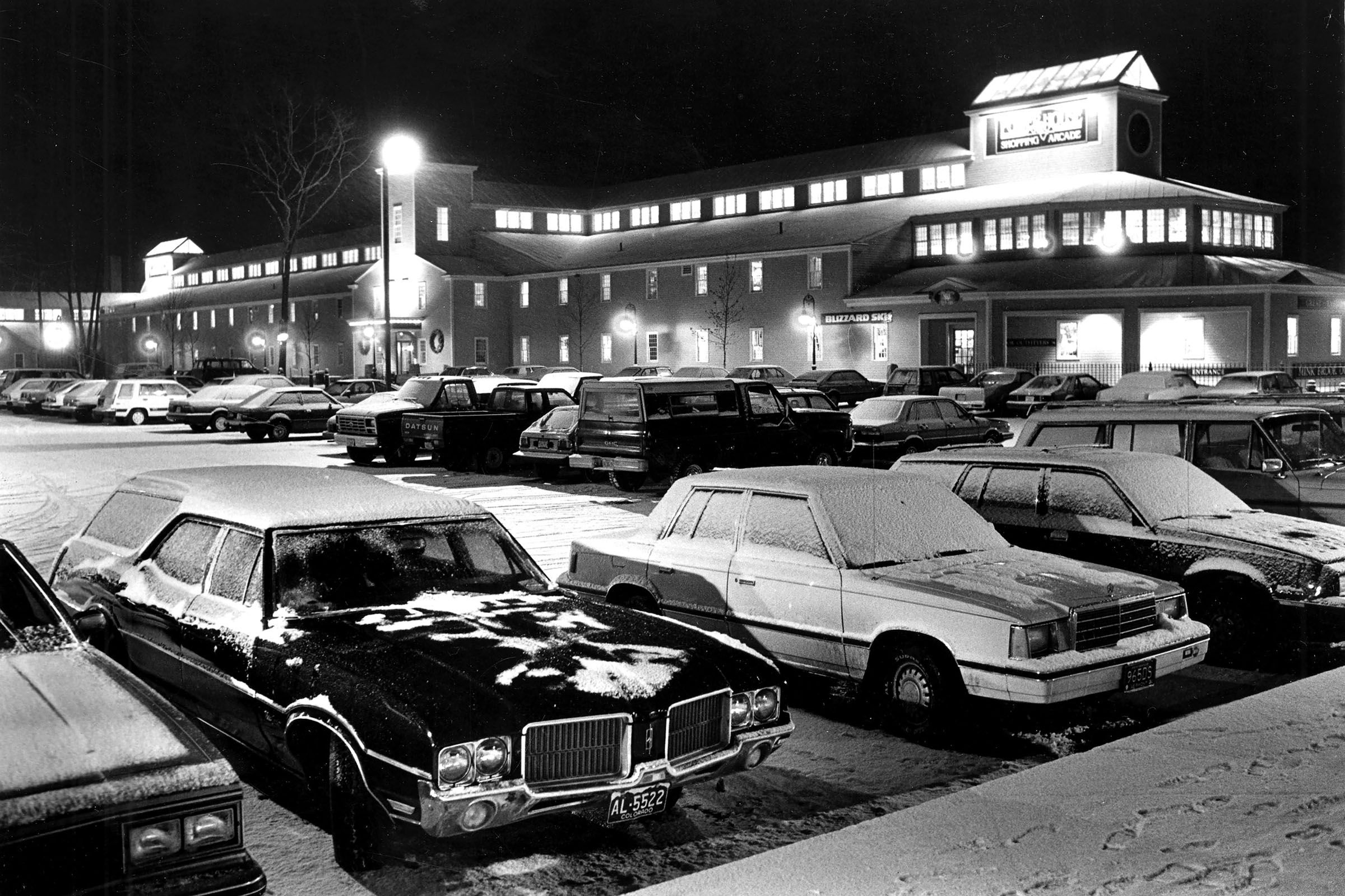 The parking lot at the Powerhouse Mall in West Lebanon, N.H., is filled with holiday shoppers in a mid-1980s photograph. The renovated mill building opened earlier in the decade. (Valley News - Dan Hunting) Copyright Valley News. May not be reprinted or used online without permission. Send requests to permission@vnews.com.
