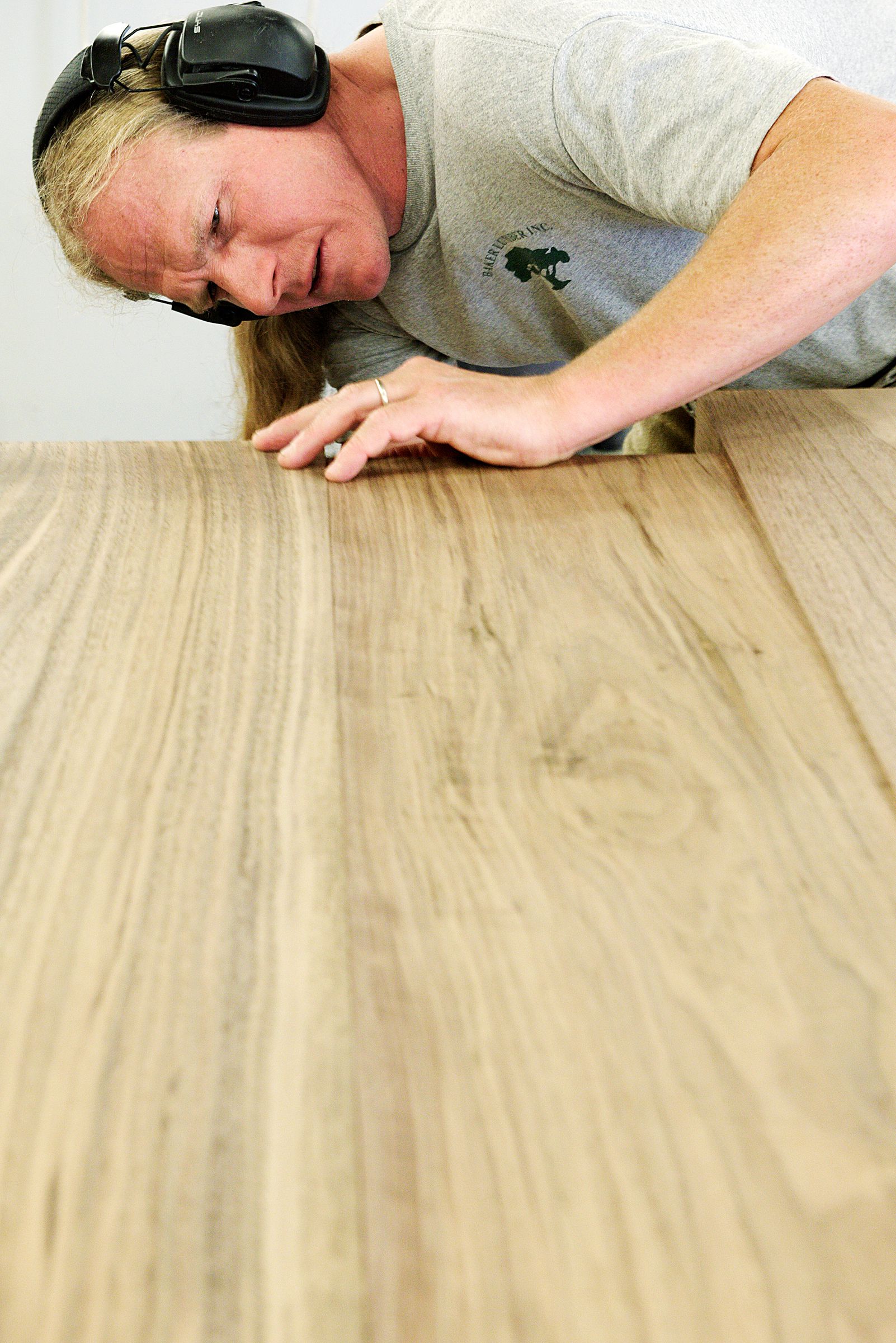 Cabinet maker Andy Mulligan measures the thickness of walnut boards that will be joined to make a countertop for a residential customer in the Trumbull-Nelson Construction Company's carpentry shop in Hanover, N.H., Thursday, September 15, 2017. Trumbull-Nelson is celebrating 100 years since its founding in 1917. (Valley News - James M. Patterson) Copyright Valley News. May not be reprinted or used online without permission. Send requests to permission@vnews.com.