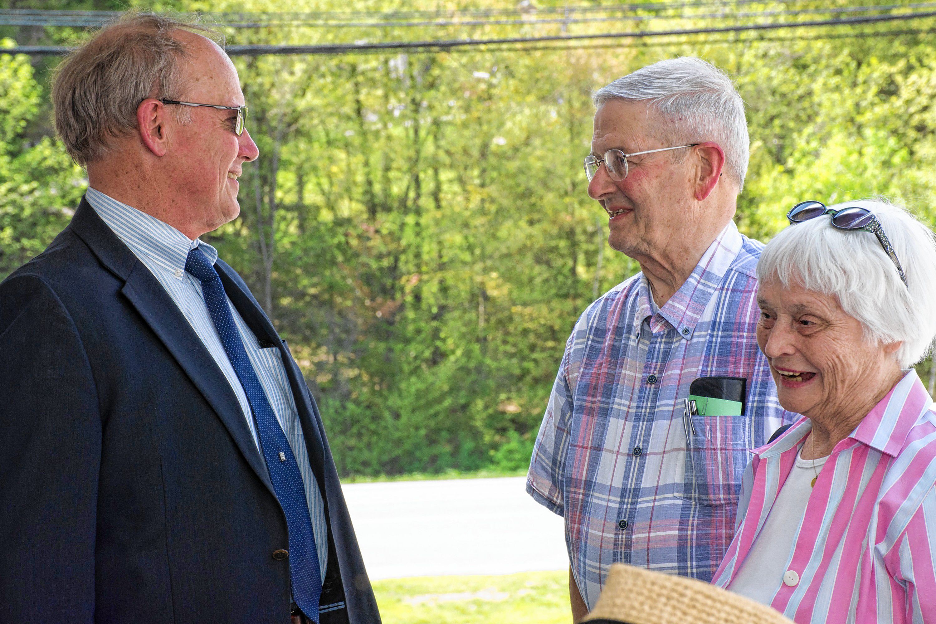 Trumbull-Nelson Construction Co. Executive Vice President Ron Bauer, left, speaks with Jack and Jane DeGange at the company's 100th anniversary celebration in Hanover, N.H., on May 18, 2017. Bauer has been with the company since 1981. Jane DeGange is the former director of David's House, built by Trumbull-Nelson. (Nancy Nutile-McMenemy photograph)