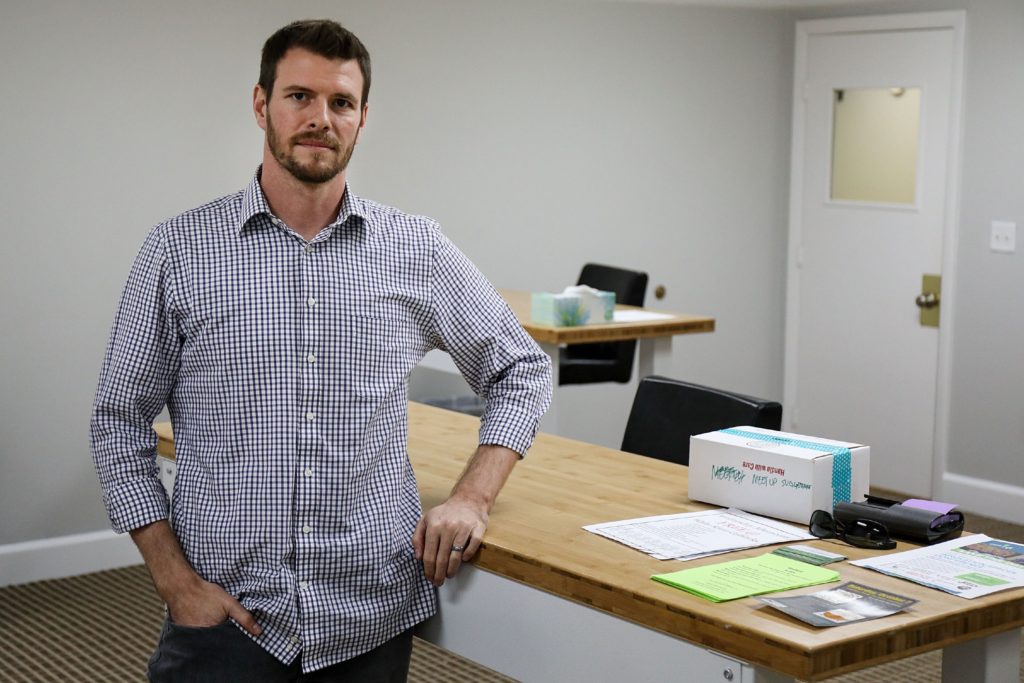 Ryan Munn, curator at White River CoWorks, in a common area at the co-working space on Thursday, Oct. 12, 2017, in White River Junction, Vt. Munn said that the open floor plan of the shared workspace allows for collaboration among users.   (Valley News - Charles Hatcher) Copyright Valley News. May not be reprinted or used online without permission. Send requests to permission@vnews.com.