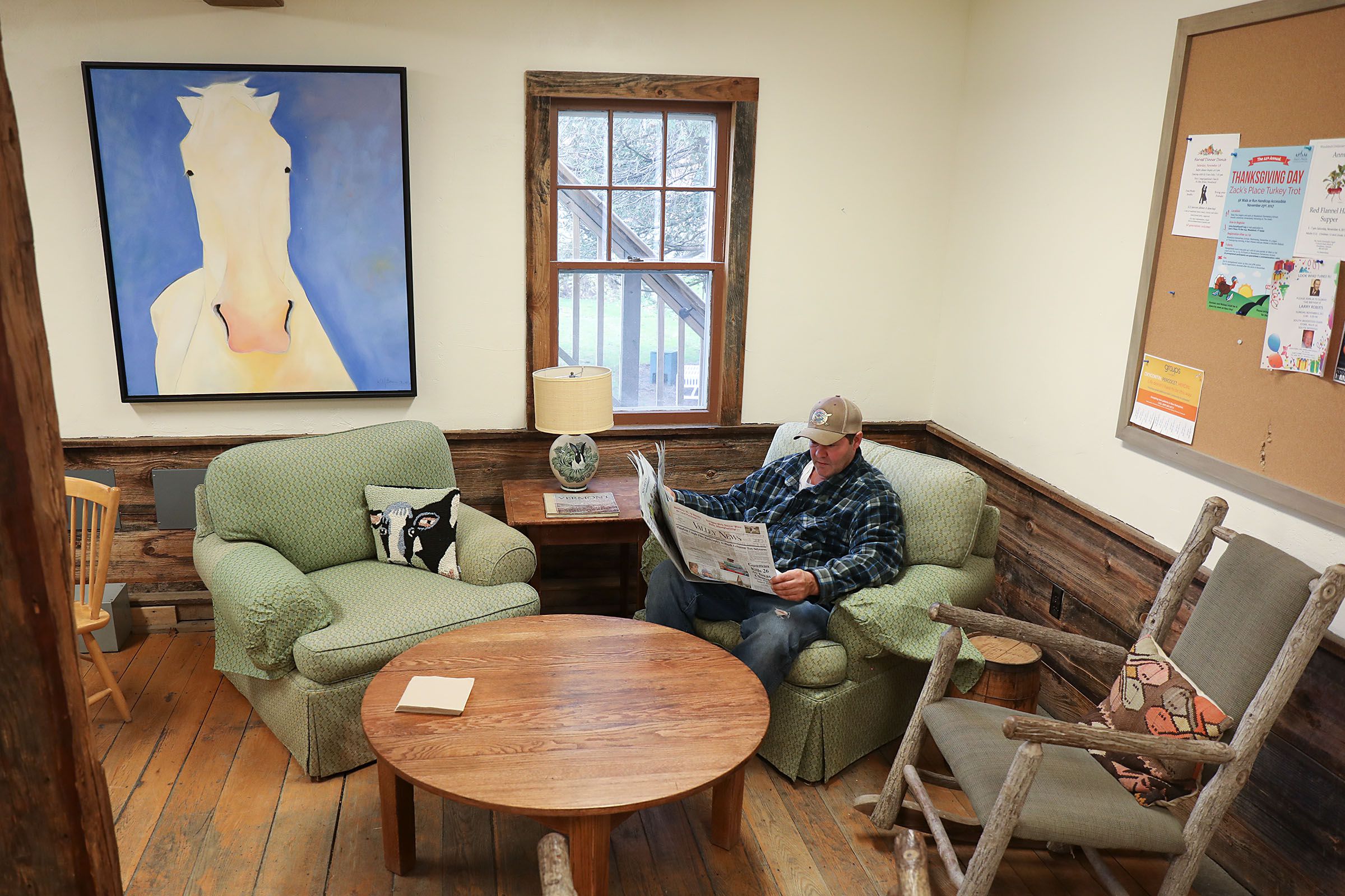 Chip Hutt, of Hartland, Vt., reads the a newspaper after having a cup of coffee on Nov. 7, 2017, at the South Woodstock Country Store in South Woodstock, Vt. Hutt said that he lives close by and has been coming to the country store for many years. (Valley News - Charles Hatcher) Copyright Valley News. May not be reprinted or used online without permission. Send requests to permission@vnews.com.