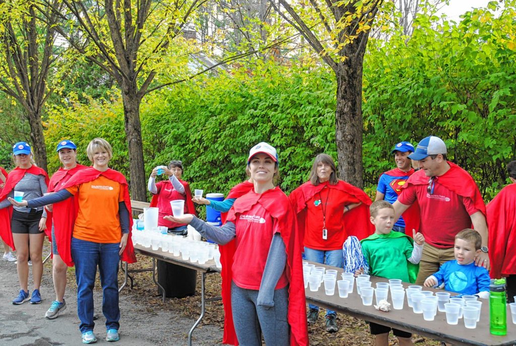 King Arthur Flour employees volunteer at the water table during the CHaD Hero Half Marathon in October. The race benefits the Children's Hospital at Dartmouth-Hitchcock. (Dan Grossman photograph)