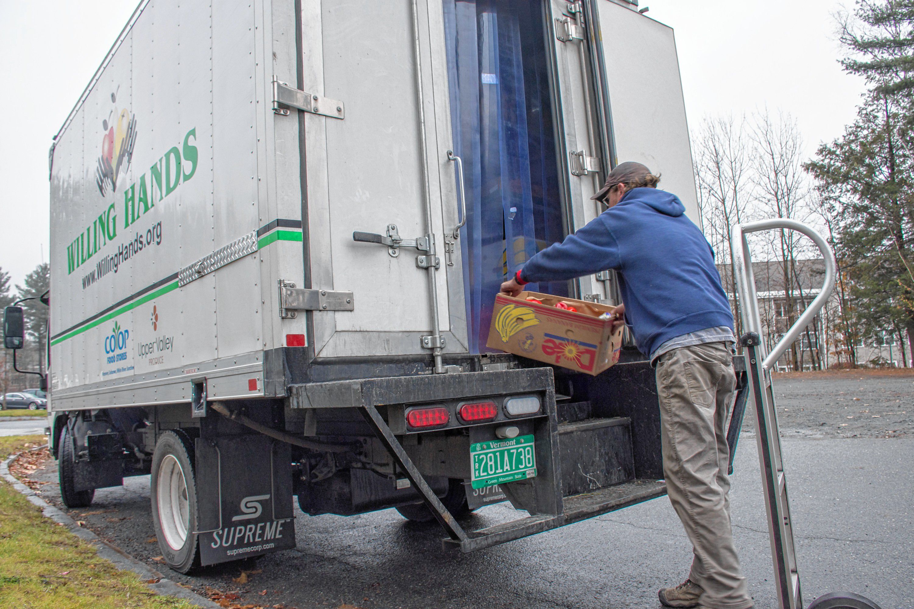 Chris Castles from Corinth, Vt. loads up the Willing Hands truck at the Lebanon Co-Op store. Next stop the Hanover Co-Op store. Nancy Nutile-McMenemy photograph.