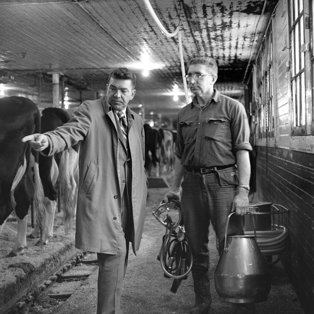 Supt. William Siegmund, left, discusses the herd at the Grafton County farm with herdsman Charles Page in North Haverhill, N.H., in Feb. 1973. The 90 county-owned cows produced more than one million pounds of milk in 1972, and income of $65,000. (Valley News - George Lambert) Copyright Valley News. May not be reprinted or used online without permission. Send requests to permission@vnews.com.