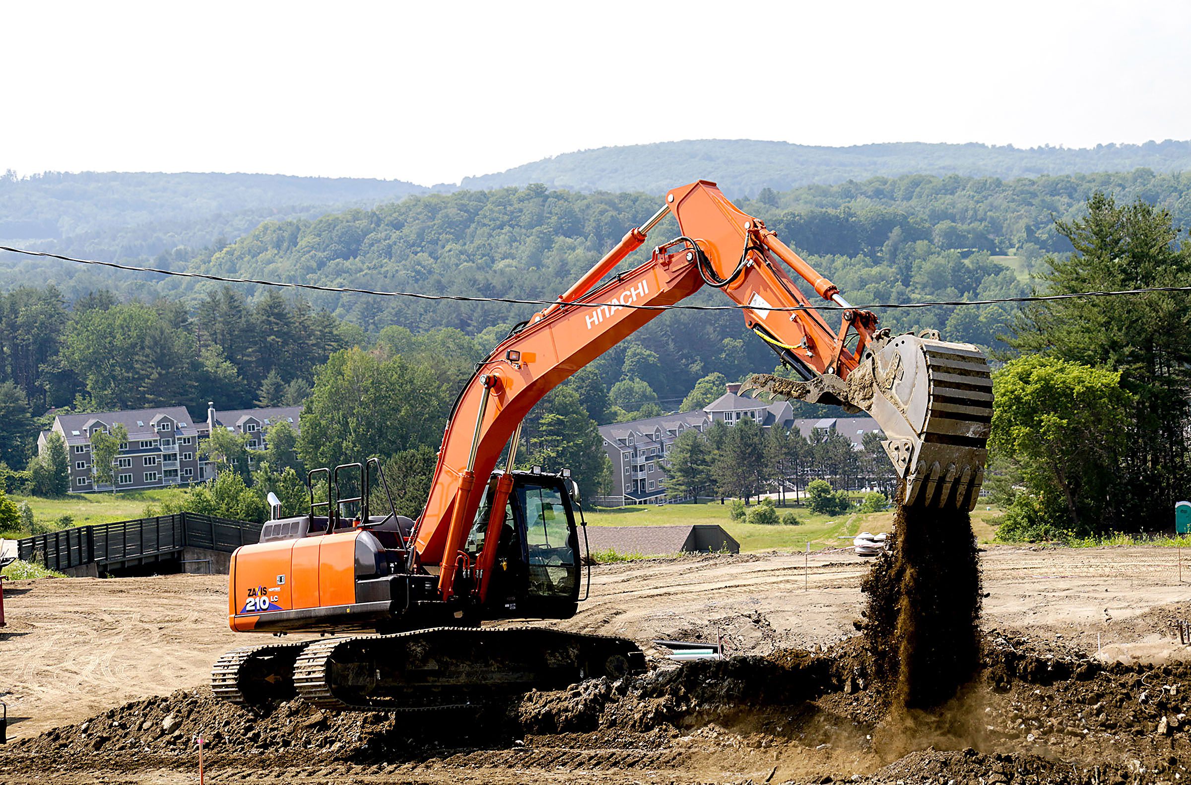 Glenn Seward operates an excavator as he builds new paths at the Ascutney mountain Base Lodge, in Brownsville, Vt., on Monday, July 2, 2018. (Valley News - August Frank) Copyright Valley News. May not be reprinted or used online without permission. Send requests to permission@vnews.com.