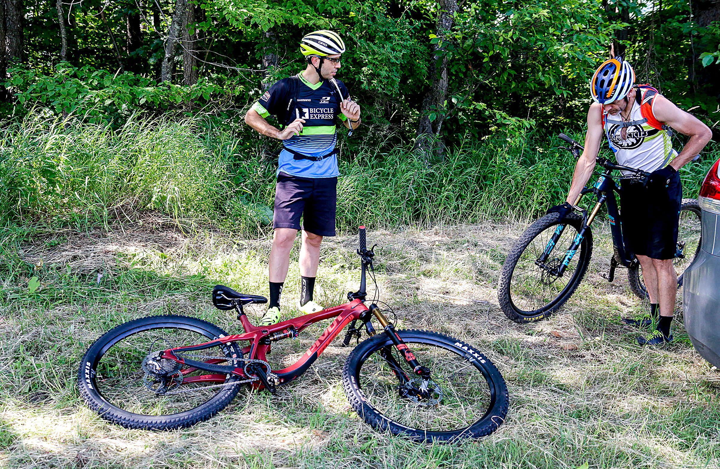 David Crothers, of Waterbury, Vt., and Tyler Merritt, of Richmond, Vt., get ready for a mountain bike ride up Ascutney Mountain from the Base Lodge, in Brownsville, Vt., on Monday, July 2, 2018. (Valley News - August Frank) Copyright Valley News. May not be reprinted or used online without permission. Send requests to permission@vnews.com.