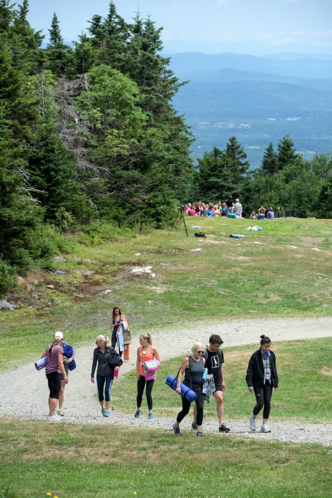 Yoga participants walk back to the ski lift for a ride down Mount Sunapee after their class Wednesday, July 11, 2018. (Valley News - James M. Patterson) Copyright Valley News. May not be reprinted or used online without permission. Send requests to permission@vnews.com.