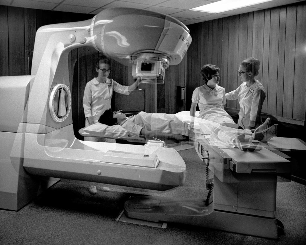 Shown in a double-exposure in Hanover, N.H., on April 22, 1968, the latest equipment -- a new cobalt unit -- at Mary Hitchcock Memorial Hospital will enable broader program of cancer treatment. (Valley News - Larry McDonald) Copyright Valley News. May not be reprinted or used online without permission. Send requests to permission@vnews.com.