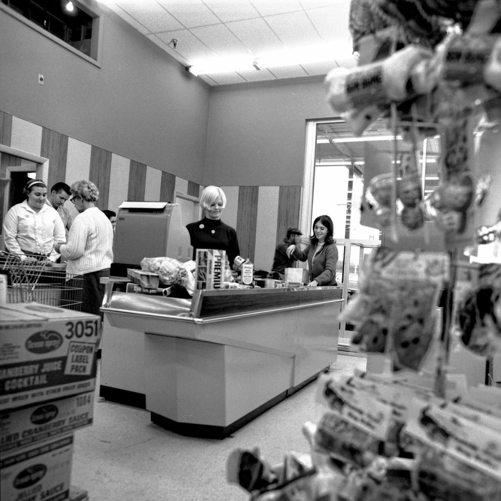 Cashiers at the Purity Supreme Supermarket, scheduled to open on Dec. 11, 1968, at the West Lebanon Shopping Center, practice up for the large customer turnout expected at the grand opening. Contractors were hard at work wrapping up the finishing touches while clerks stocked the shelves in West Lebanon, N.H. (Valley News - Larry McDonald) Copyright Valley News. May not be reprinted or used online without permission. Send requests to permission@vnews.com.