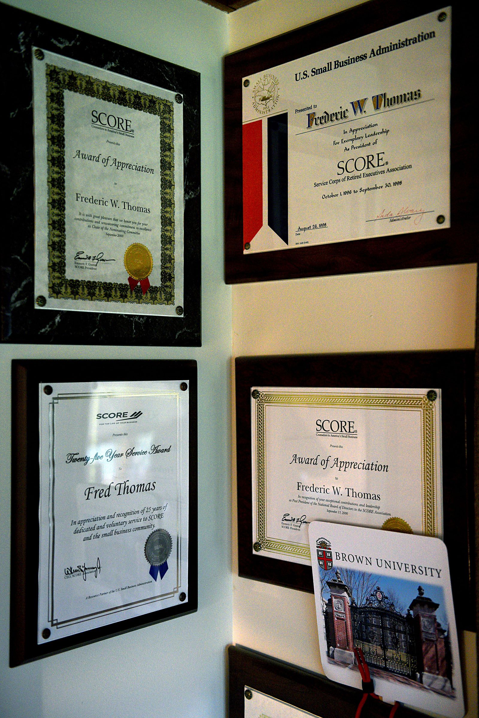 A collection of the honors and awards Fred Thomas has received for his work with SCORE is on display at his Thetford, Vt., home on Sept. 20, 2018. (Valley News - Jennifer Hauck) Copyright Valley News. May not be reprinted or used online without permission. Send requests to permission@vnews.com.