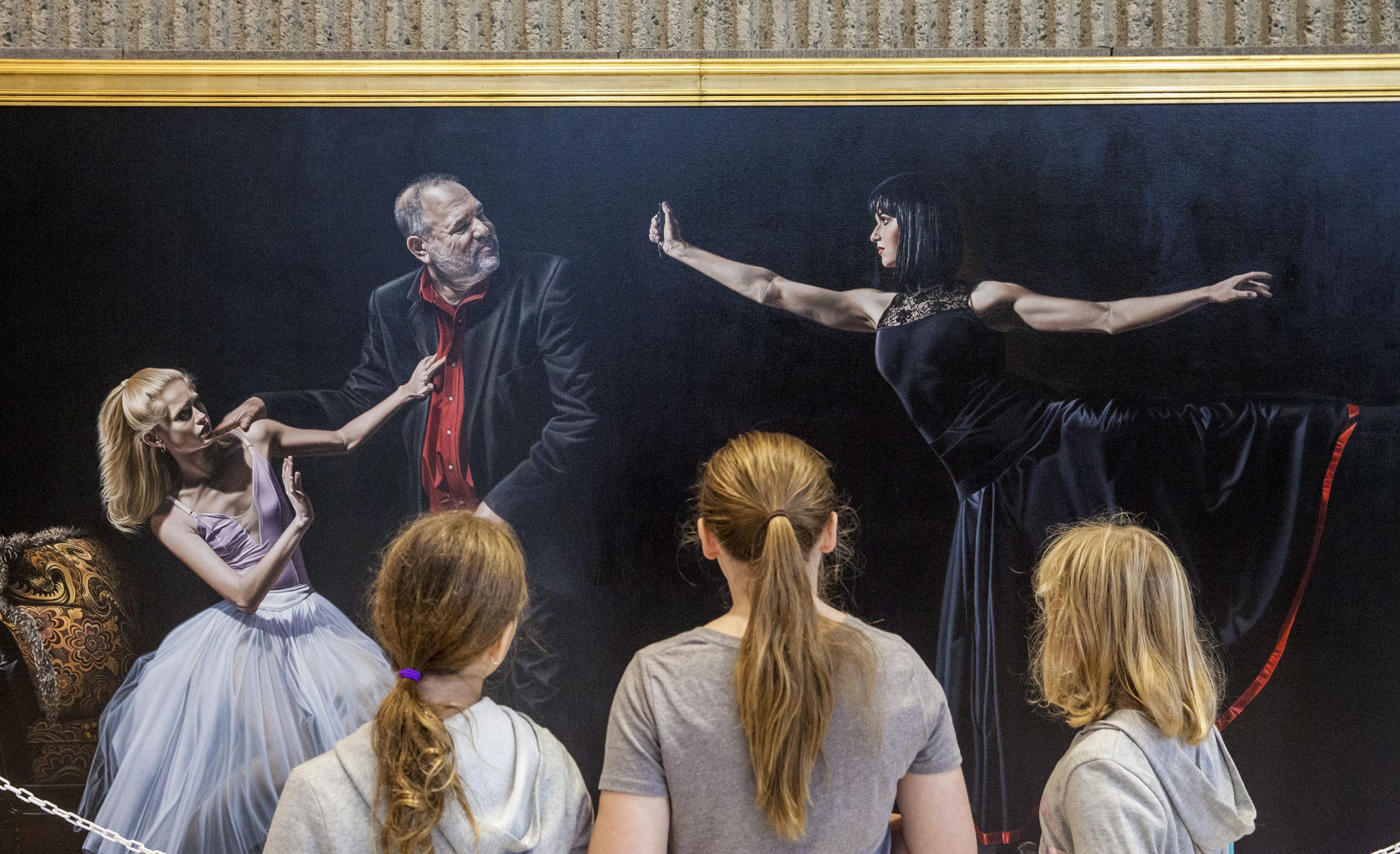 Children look at Kevin Grass' and Michaela Oberlaender's ArtPrize entry "Not #MeToo: No More Casting Couch" at the Gerald R. Ford Presidential Museum in Grand Rapids on Wednesday, Sept. 19, 2018. The work is about sexual harassment in America. According to the artwork's description: "It shows one ballerina rebuffing Harvey Weinstein, while the other one is ready to pepper spray him. These ballerinas are not comfortable with the idea of the 'casting couch.' The Harvey Weinstein scandal began the #MeToo movement that is changing what is considered acceptable behavior between individuals. The piece shows women empowered to fight back against sexual abuses." Cory Morse | MLive.com