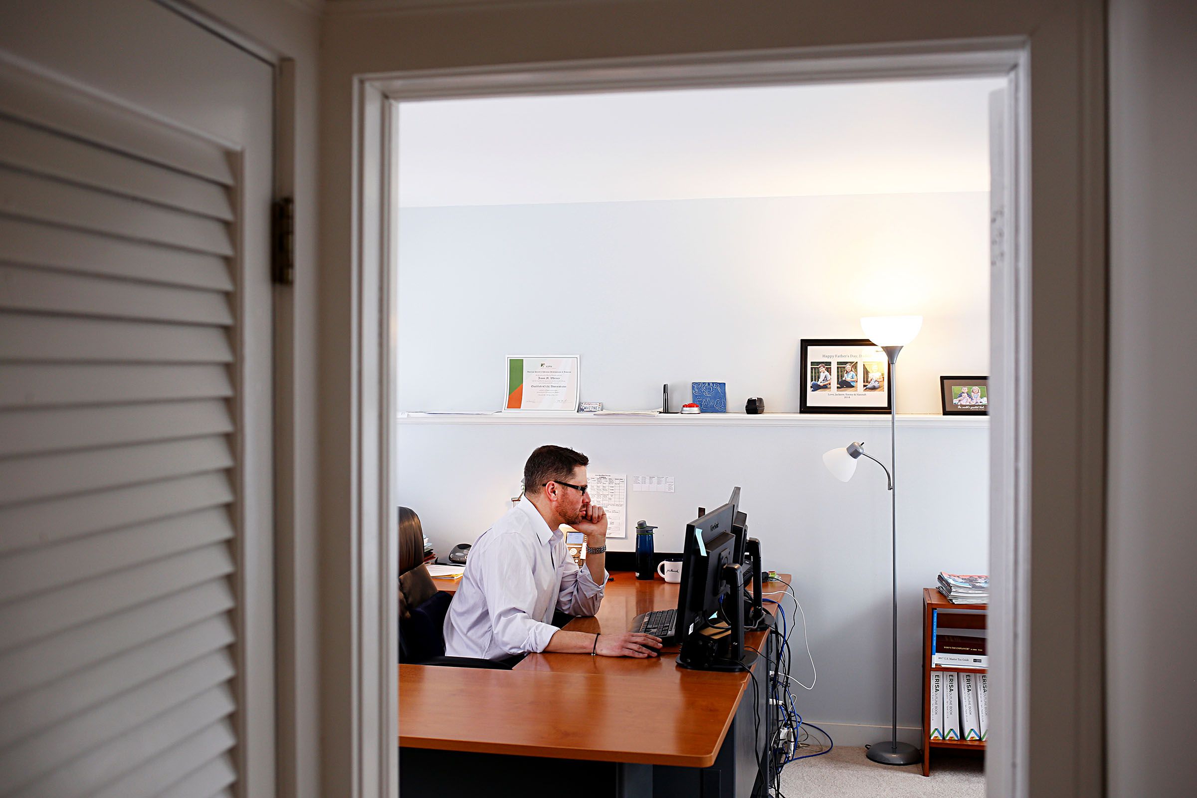 Jason Whitney works in his office at Whitney Pension Associates Inc. in Quechee, Vt., on Jan. 10, 2019. Jason has taken over his father's retirement advising business. (Valley News - Joseph Ressler) Copyright Valley News. May not be reprinted or used online without permission. Send requests to permission@vnews.com.