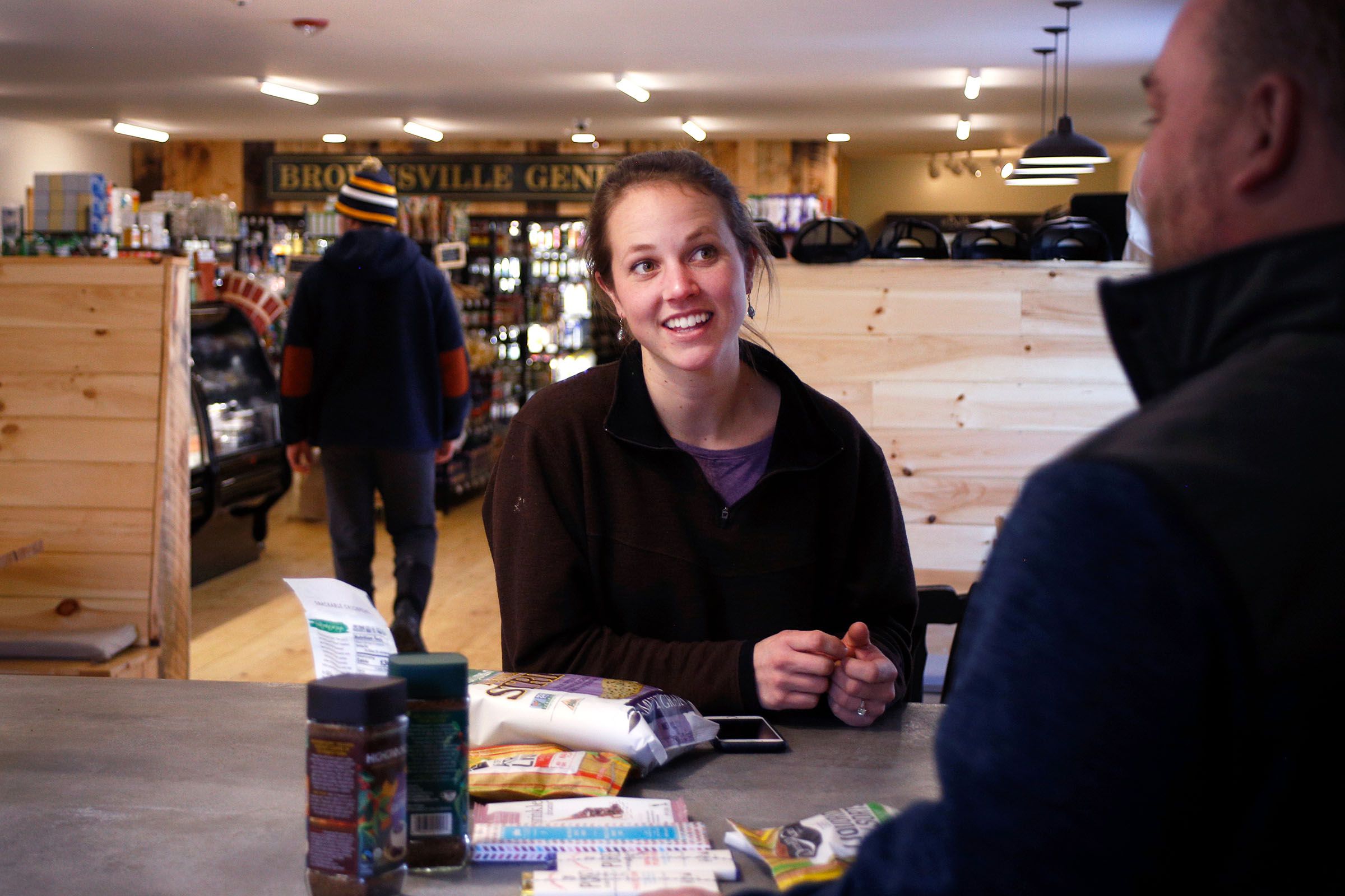 Co-owner Lauren Stevens talks with a distributor about new products for the store at the Brownsville Butcher & Pantry in Brownsville, Vt., on Jan. 17, 2019. (Valley News - Joseph Ressler) Copyright Valley News. May not be reprinted or used online without permission. Send requests to permission@vnews.com.
