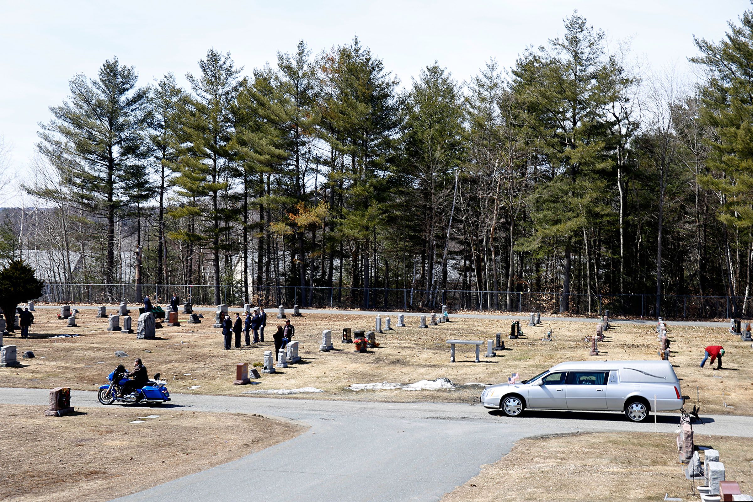 Members of the Upper Valley chapter of the Harley Owners Group lead the funeral procession for Fay "Woody" Woodward, of Sunapee, N.H., into the Sacred Heart Cemetery in Lebanon, N.H., on April 2, 2019. Except for Hawaii, Woodward had been to every state in the country on his motorcycle. (Valley News - Geoff Hansen) Copyright Valley News. May not be reprinted or used online without permission. Send requests to permission@vnews.com.