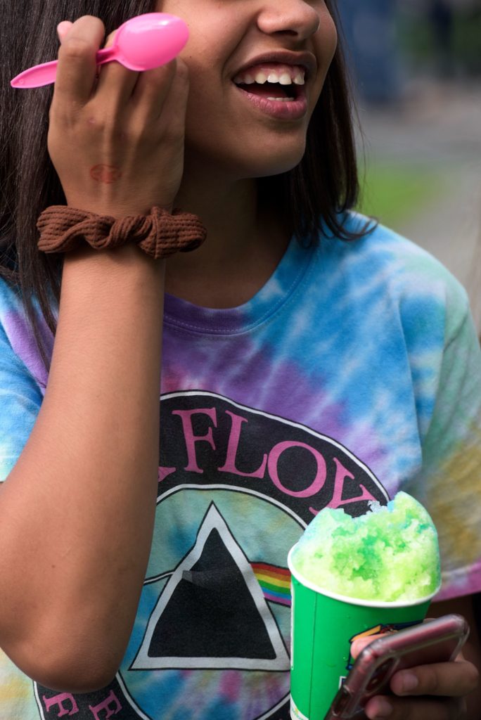 Aaliyah Rivera, 14, of Newport, enjoys a shaved ice from Kona Ice at the Lebanon (N.H.) Food Truck Festival in Colburn Park, Friday, June 21, 2019. (Valley News - James M. Patterson) Copyright Valley News. May not be reprinted or used online without permission. Send requests to permission@vnews.com.