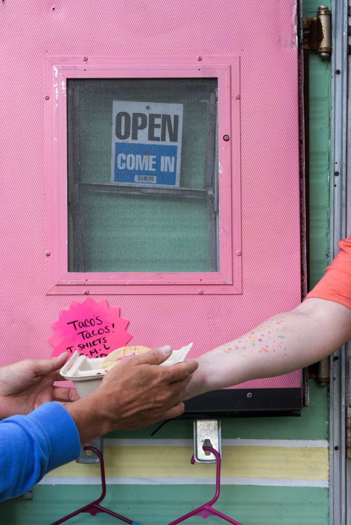Cassie Carter, of Lebanon, gives a customer his order at Taco's Tacos during the Lebanon (N.H.) Food Truck Festival in Colburn Park, Friday, June 21, 2019. Thirteen mobile food businesses participated in the two day event. (Valley News - James M. Patterson) Copyright Valley News. May not be reprinted or used online without permission. Send requests to permission@vnews.com.