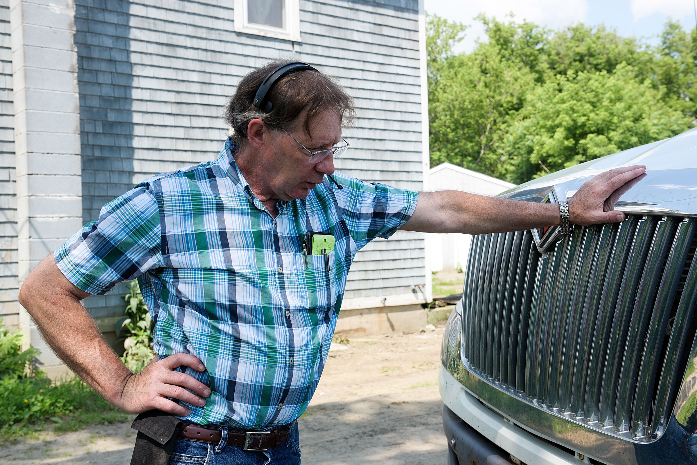 IBA dealer John Kerr, of Brandon, Vt., takes a phone call during a stop at Perley Farm in Royalton, Vt., Wednesday, July 3, 2019. Kerr has three brothers that are also IBA dealers. (Valley News - James M. Patterson) Copyright Valley News. May not be reprinted or used online without permission. Send requests to permission@vnews.com.