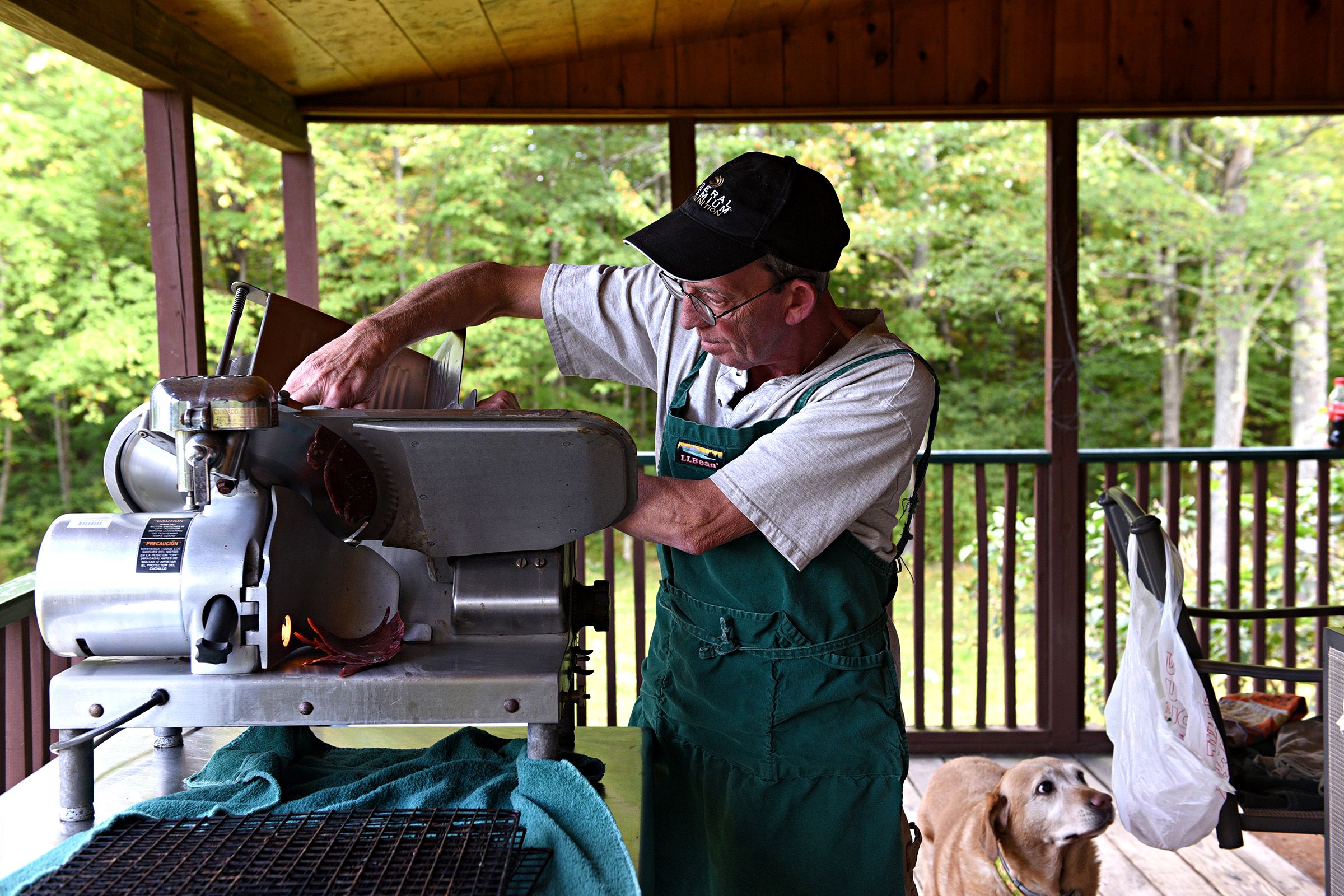 Sean Bohman, of Warner, N.H., slices frozen buffalo livers at his home on Tuesday, Sept. 24, 2019. Bohman and his wife dehydrate organ meat to make 3 Biddy's Pet Treats. (Valley News - Jennifer Hauck) Copyright Valley News. May not be reprinted or used online without permission. Send requests to permission@vnews.com.