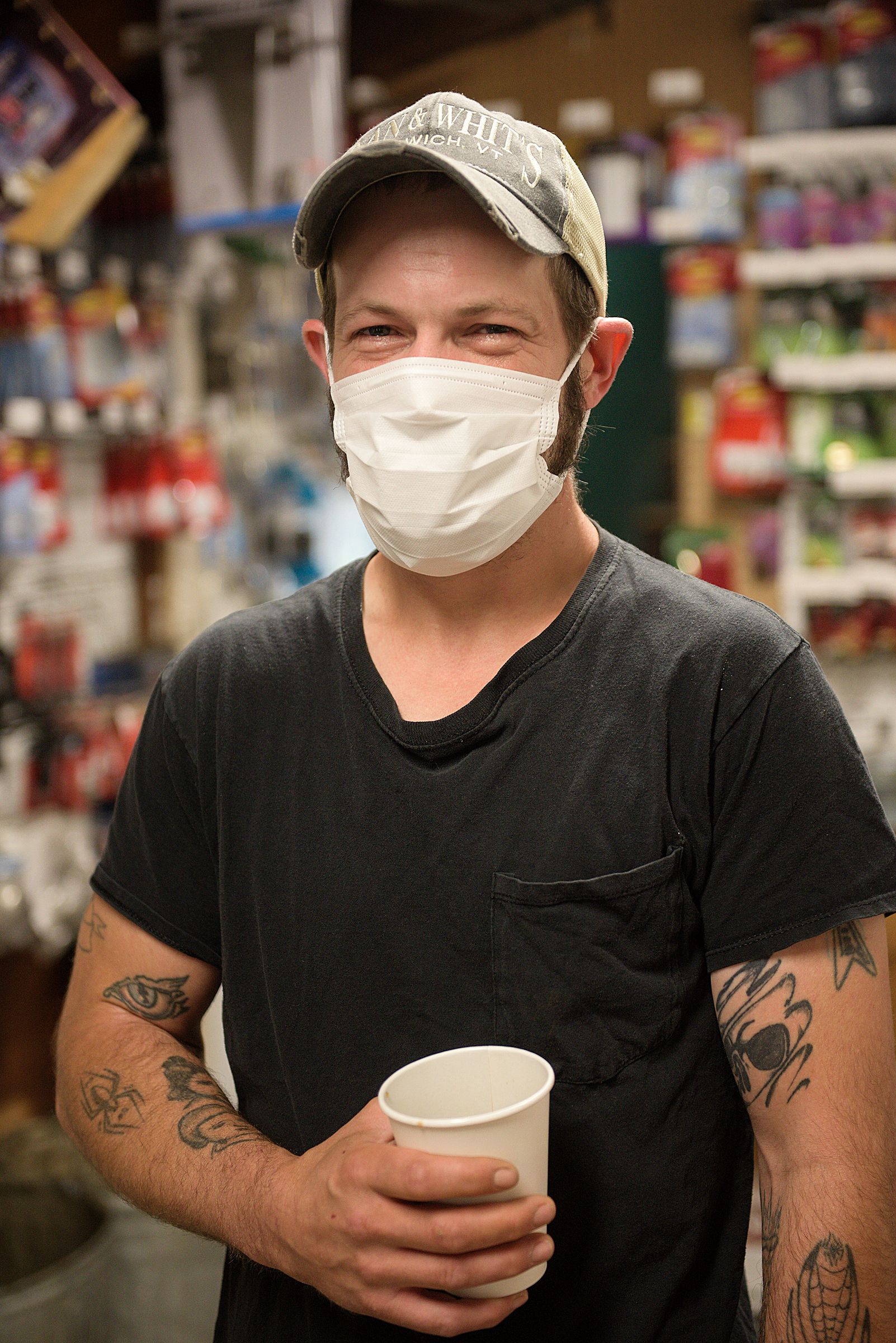 Nate Doody, of Norwich, stands for a portrait at the start of his work day at Dan and Whit’s general store in Norwich, Vt., Thursday, July 9, 2020. (Valley News - James M. Patterson) Copyright Valley News. May not be reprinted or used online without permission. Send requests to permission@vnews.com.