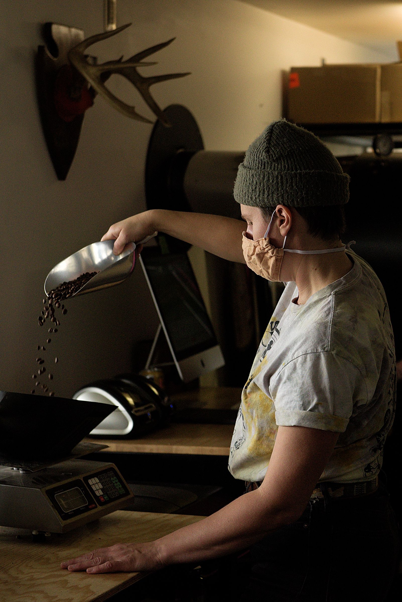 Sarah Yetter, co-owner of Abracadabra Coffee Company in Woodstock, Vt., weighs beans for packaging Tuesday, Oct. 6, 2020. (Valley News - James M. Patterson) Copyright Valley News. May not be reprinted or used online without permission. Send requests to permission@vnews.com.