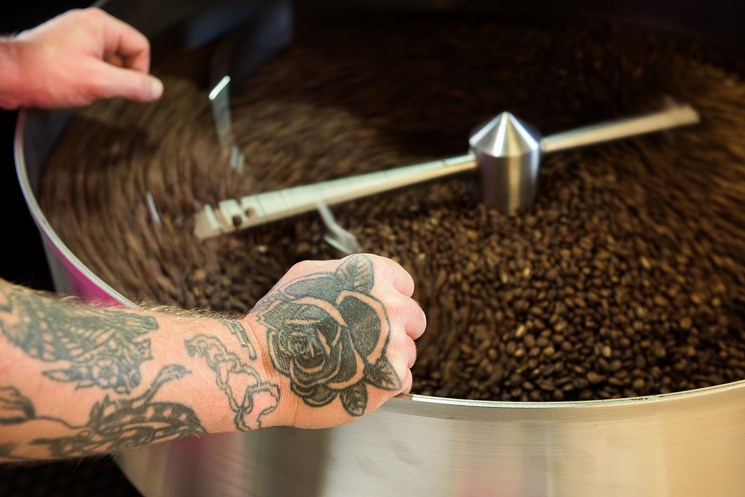 Clint Hunt, co-owner of Abracadabra Coffee Company, rests while a batch of freshly roasted beans cools in Woodstock, Vt., Tuesday, Oct. 6, 2020. (Valley News - James M. Patterson) Copyright Valley News. May not be reprinted or used online without permission. Send requests to permission@vnews.com.