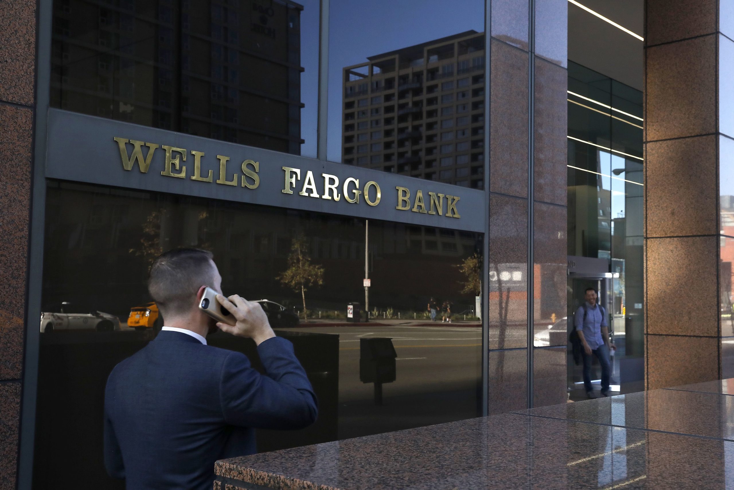 A pedestrian walks past a Wells Fargo bank in downtown Los Angeles on Feb. 5, 2018. (Mel Melcon/Los Angeles Times/TNS)